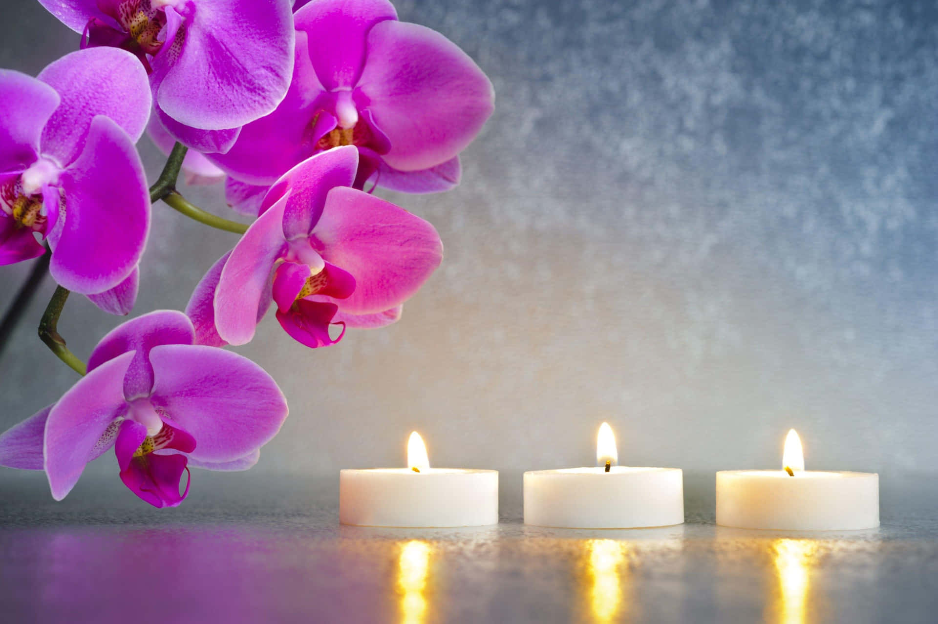 Orchidsand Candles Spa Setting Wallpaper