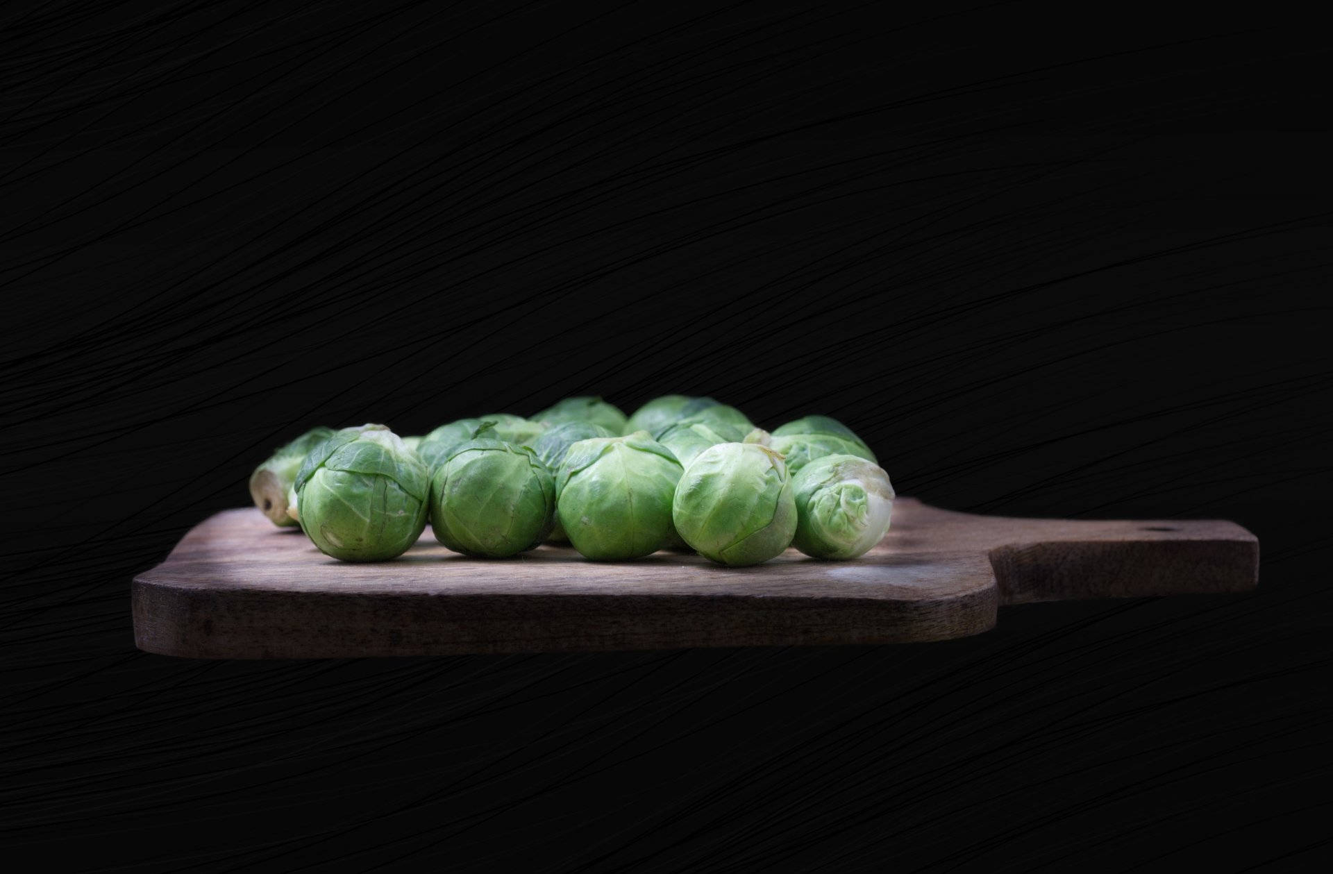 Organic Brussels Sprouts On Cutting Board Wallpaper