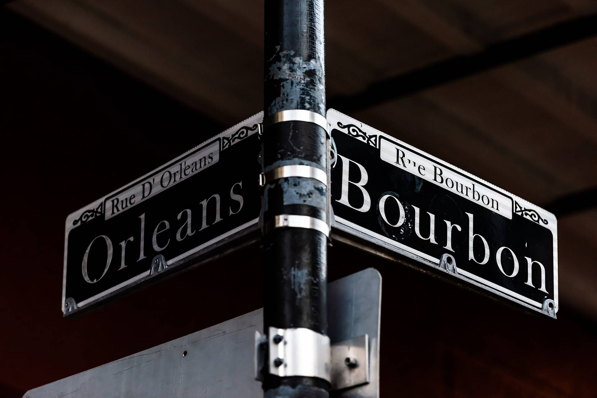 Iconic New Orleans: Bourbon Street Sign at a Crossroads Wallpaper