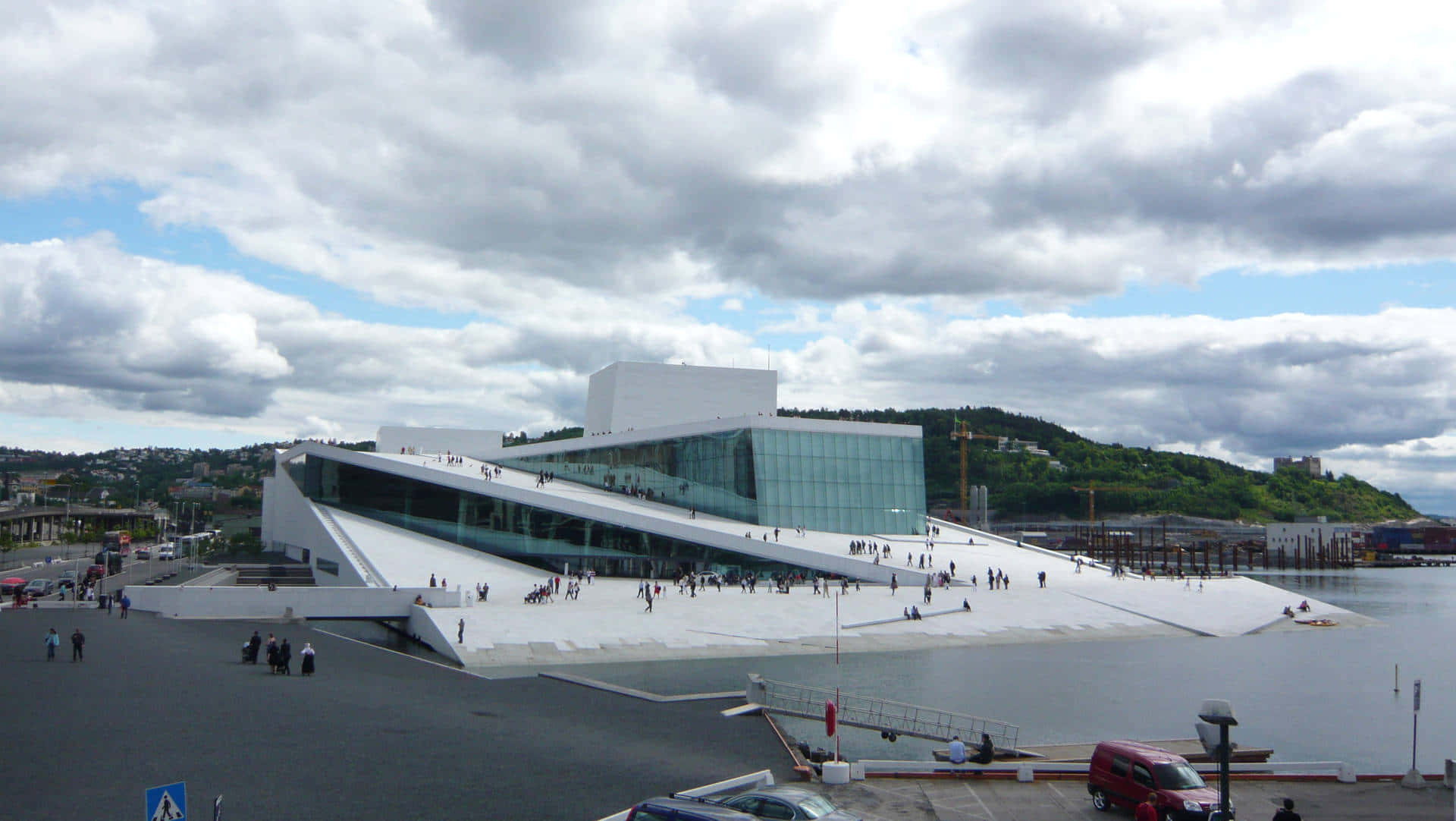 Oslo Opera House With Large Clouds Wallpaper