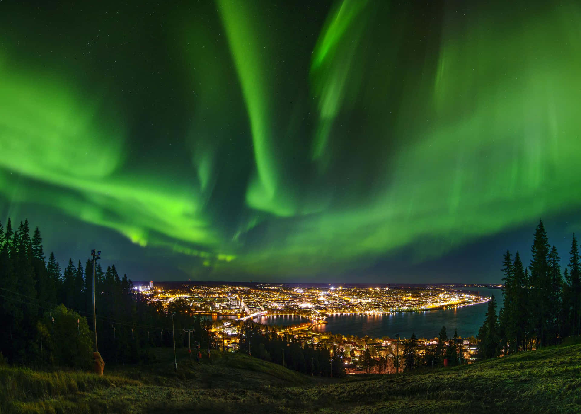 Ostersund Northern Lights Over Cityscape Wallpaper