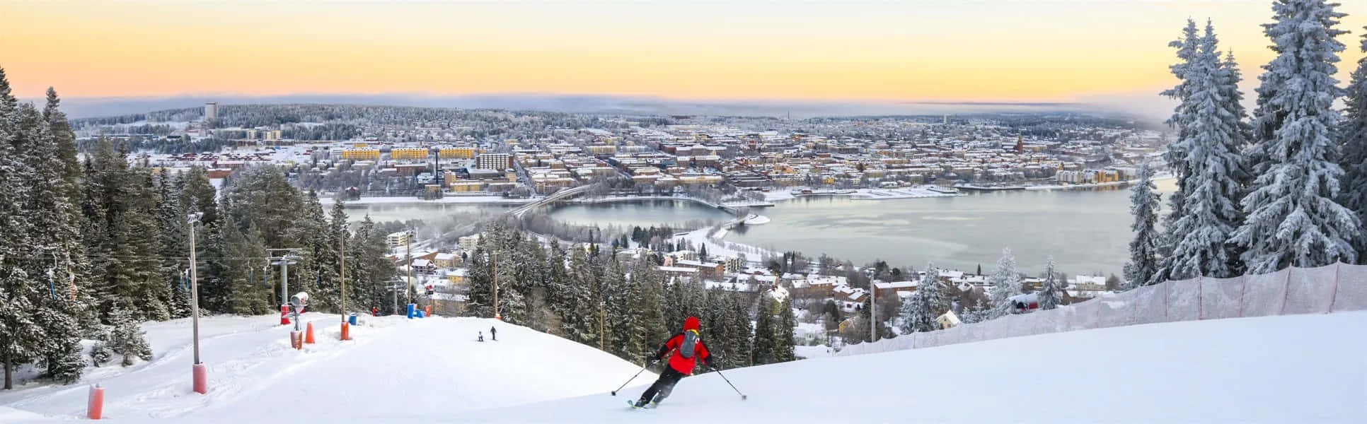 Ostersund Skiing Overlooking Cityscape Wallpaper