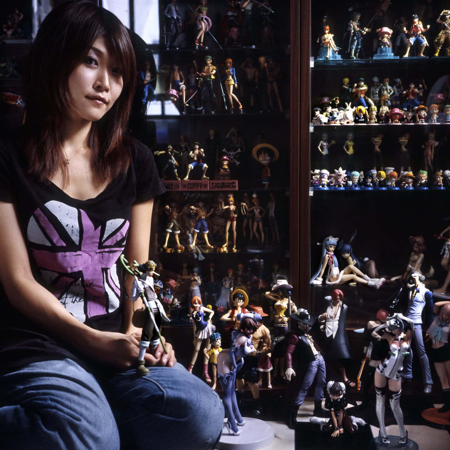 "A passionate otaku with their growing collection of anime merchandise." Wallpaper
