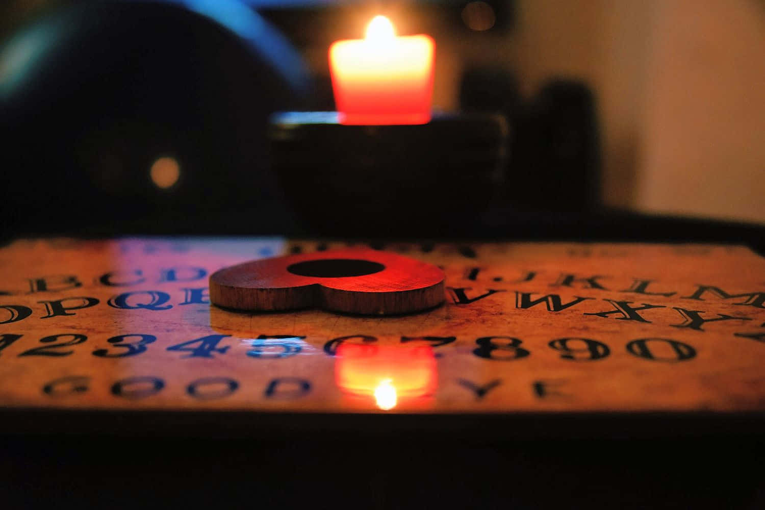 A Candle Is Lit On A Wooden Board