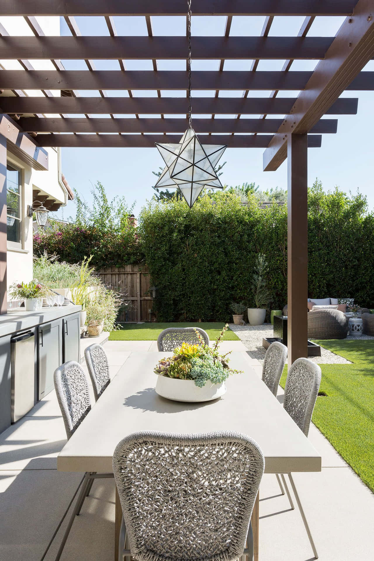 A Patio With A Table And Chairs