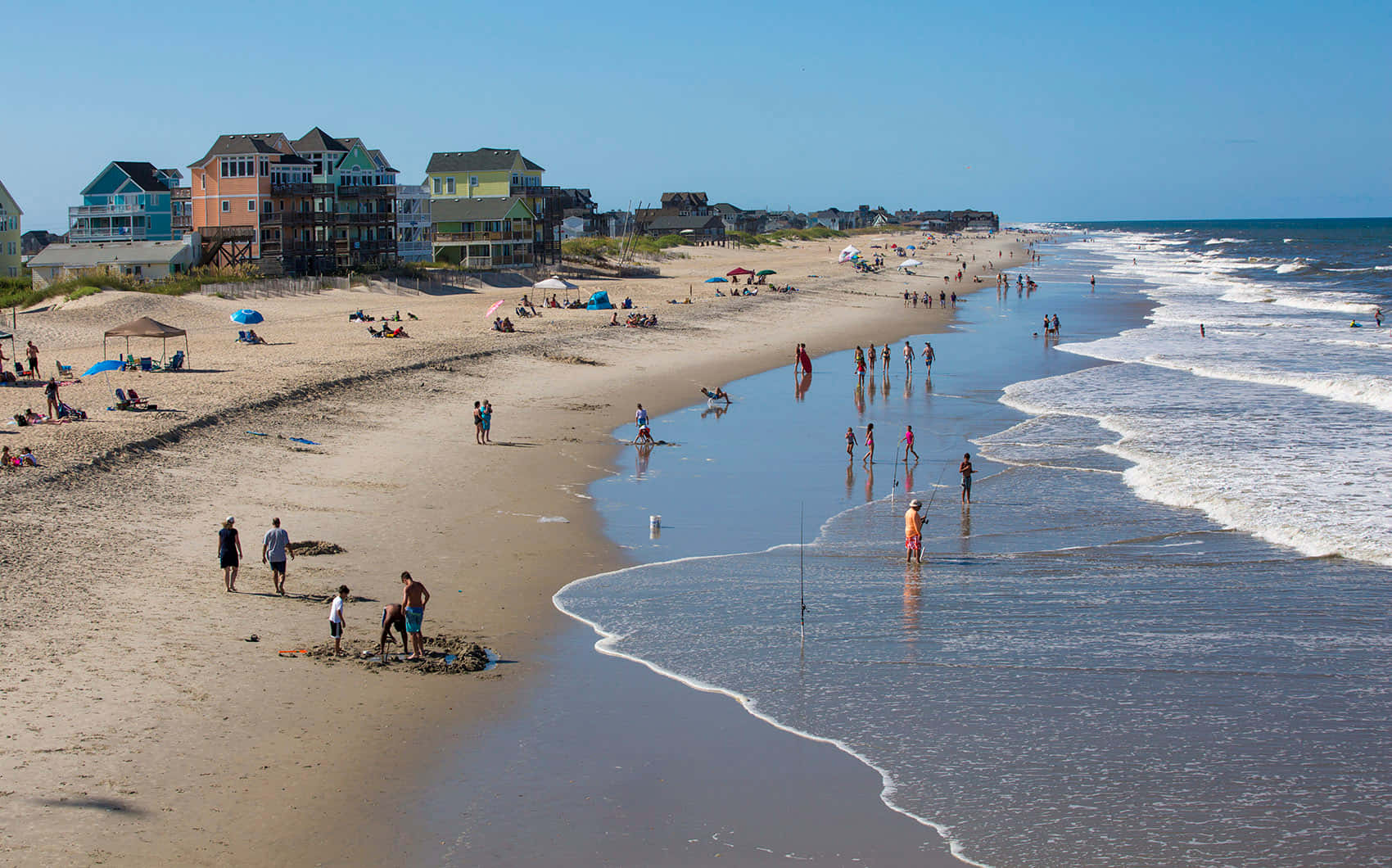 A Beach With People Walking On It