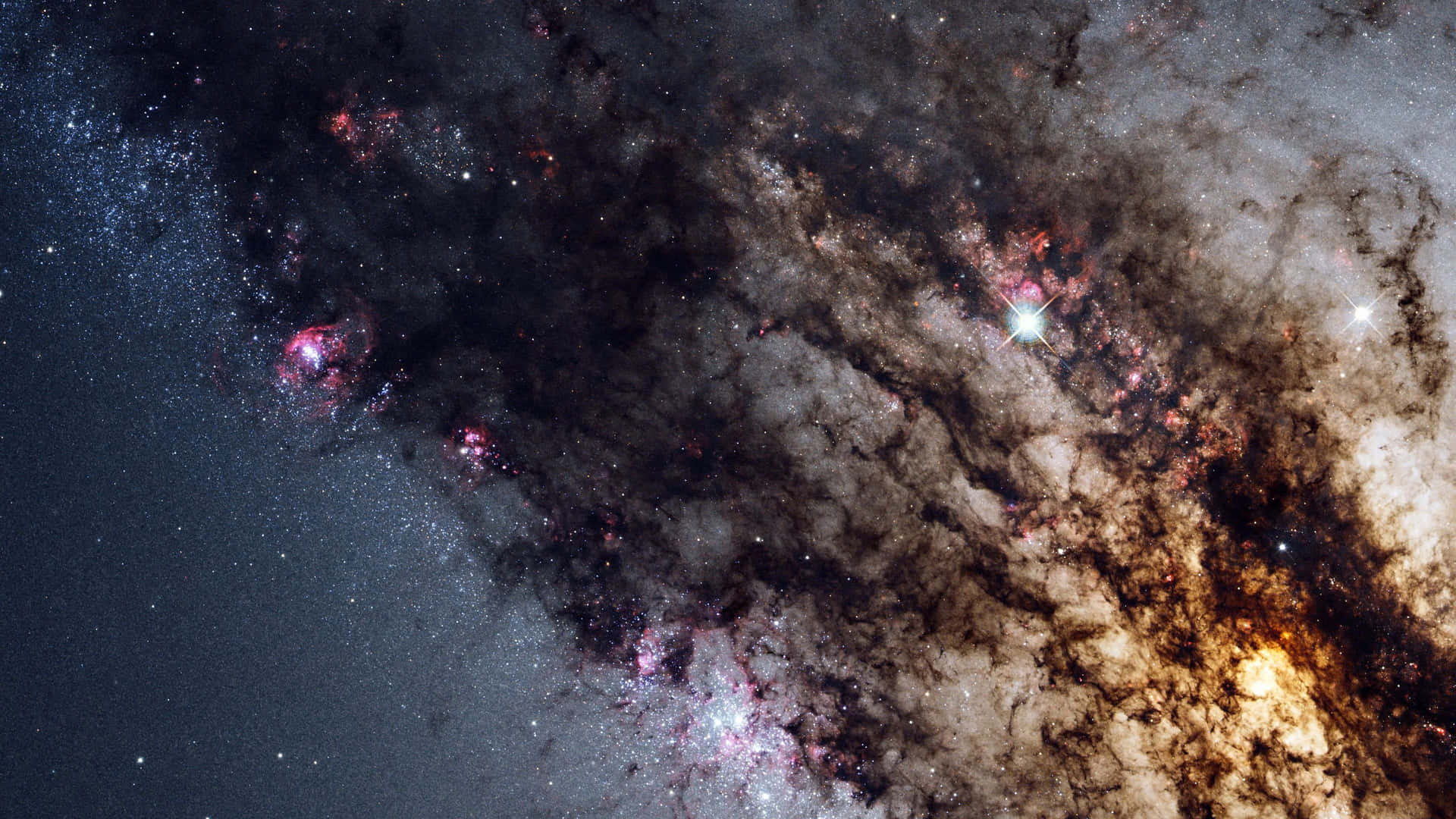 An awe inspiring glimpse of red swirling galaxies in outer space Wallpaper