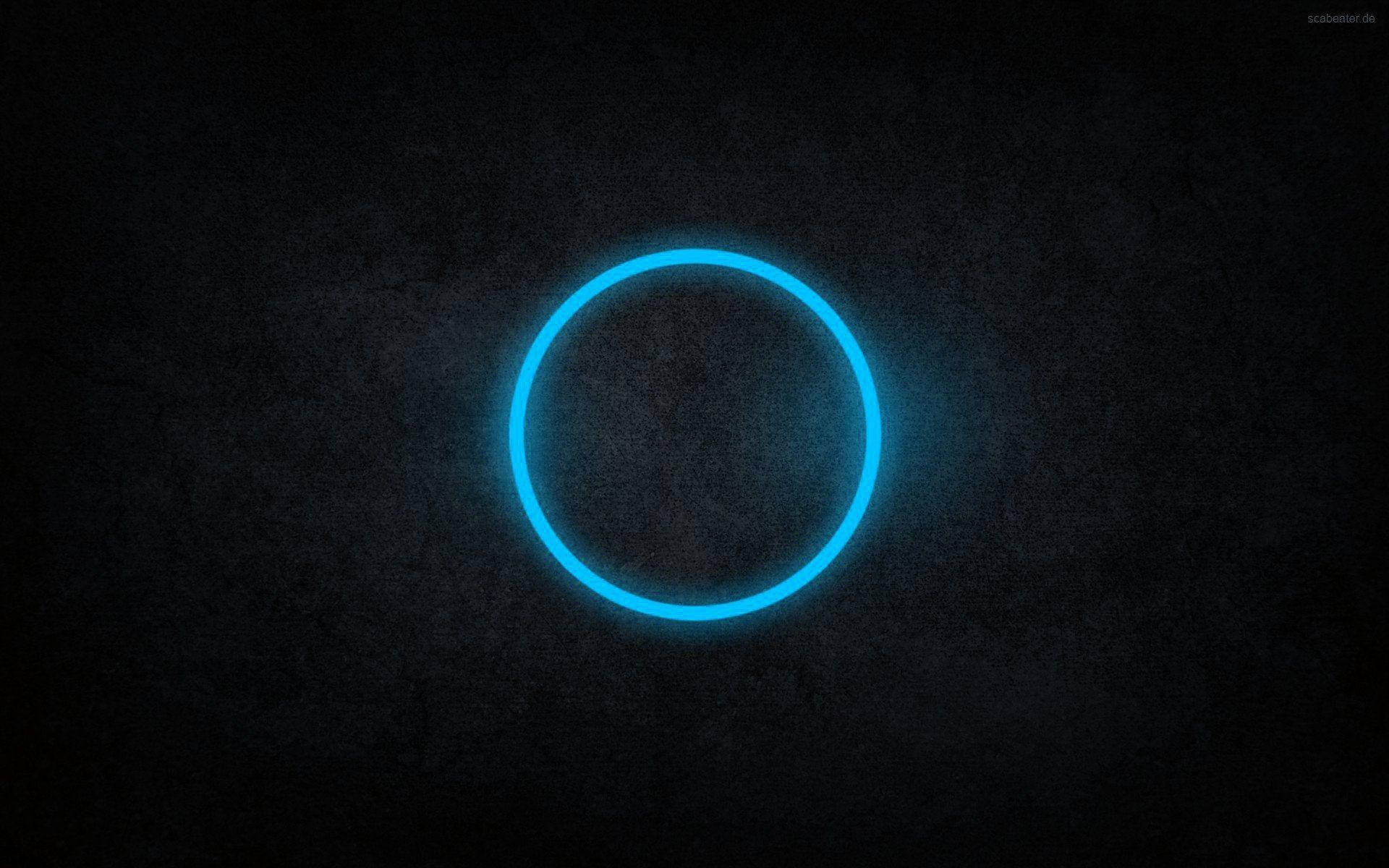 Enblå Cirkel På En Mörk Bakgrund Wallpaper