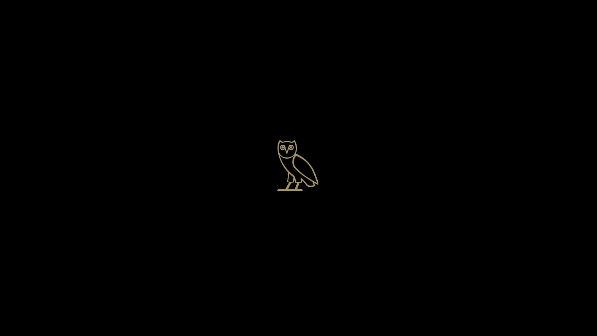 A Gold Owl On A Black Background Wallpaper