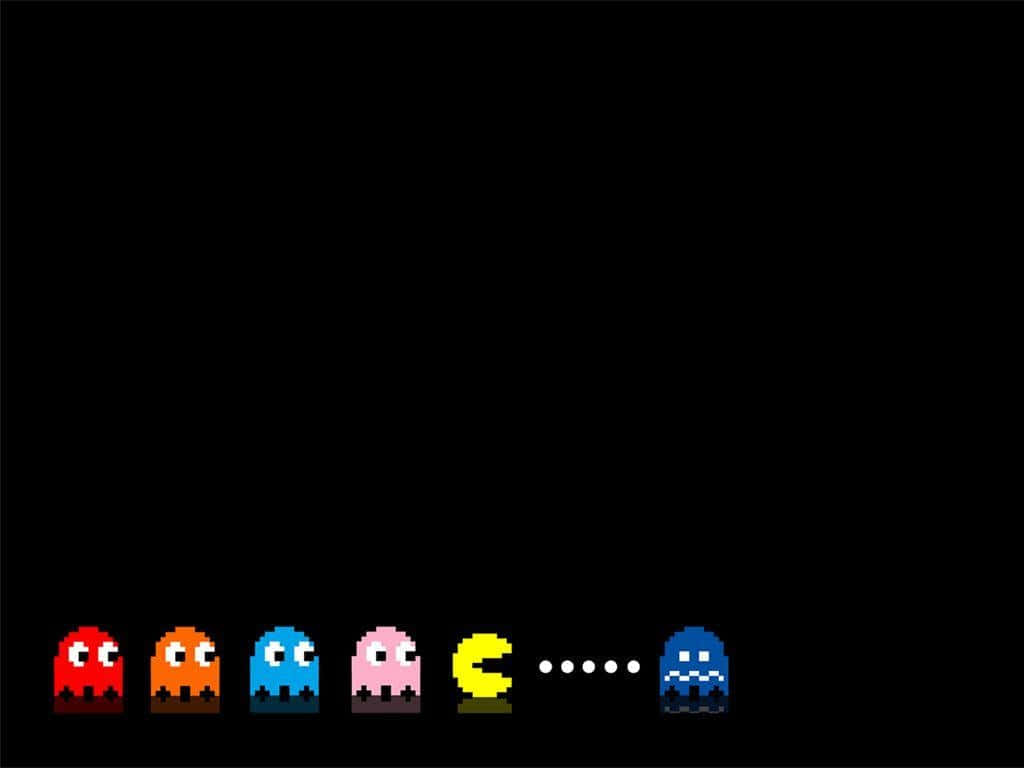 Pac Man Being Chased By Ghosts Wallpaper