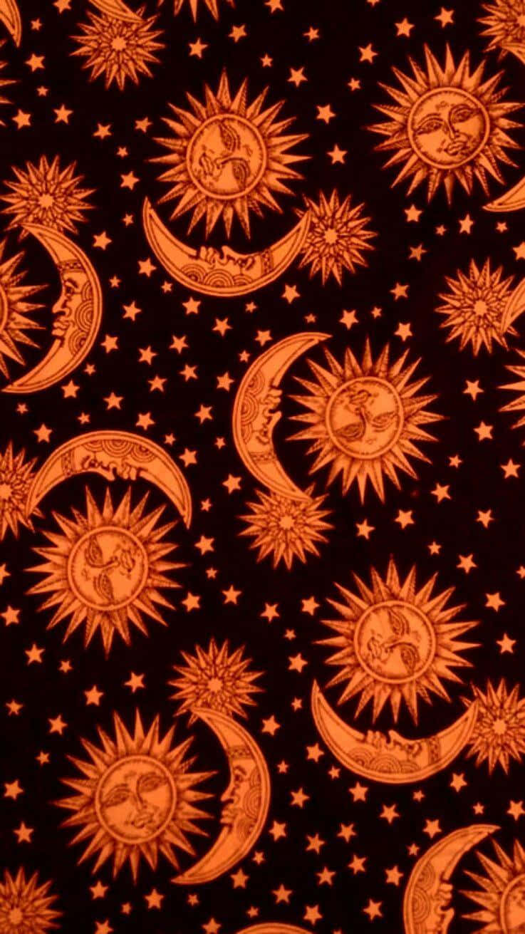 Bohemian Sun Moon Pattern Wallpaper — A repeating pattern of orange suns and moons with faces and stars on a black background.