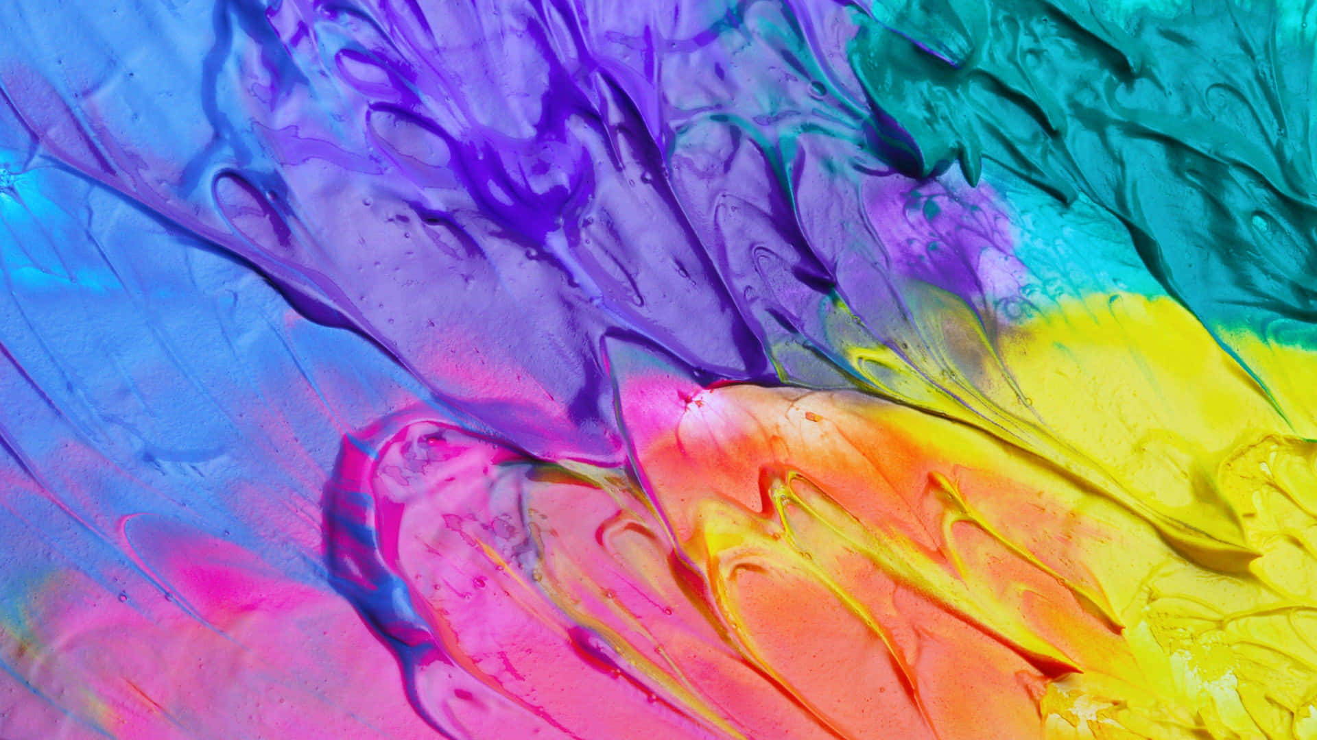 A Close Up Of Colorful Paint On A Surface