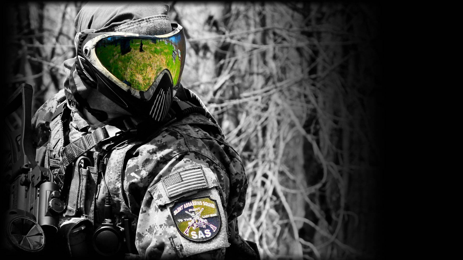 Paintball pro clad in full gear with helmet during an exciting match. Wallpaper