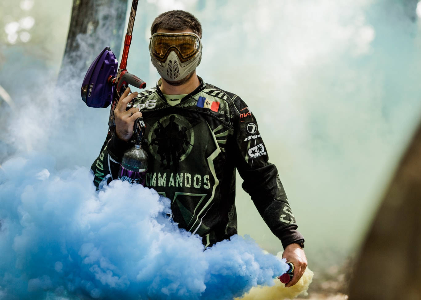 Paintball Player With Blue Smoke Wallpaper
