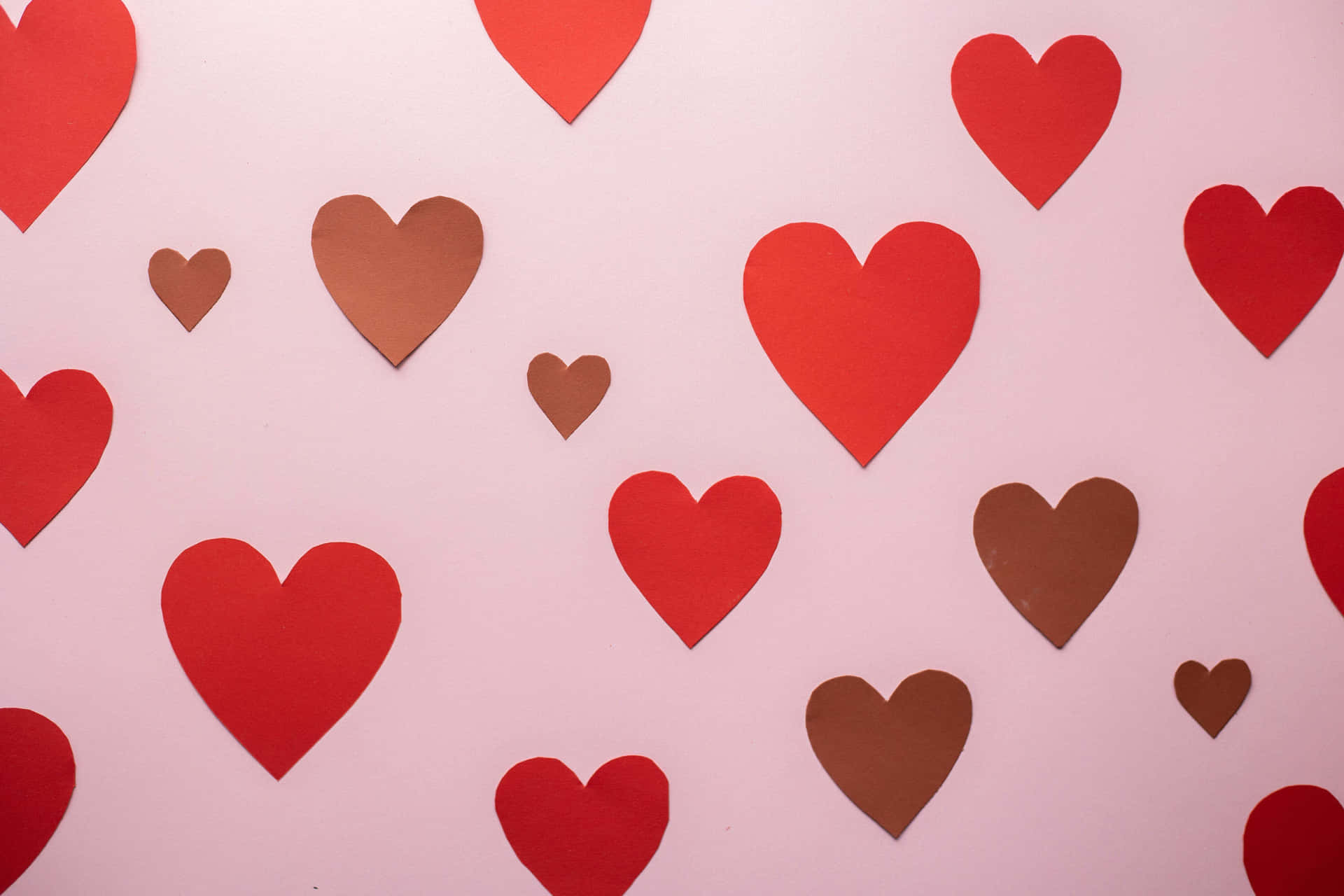 Pale Pink Backgroundwith Red Hearts Wallpaper