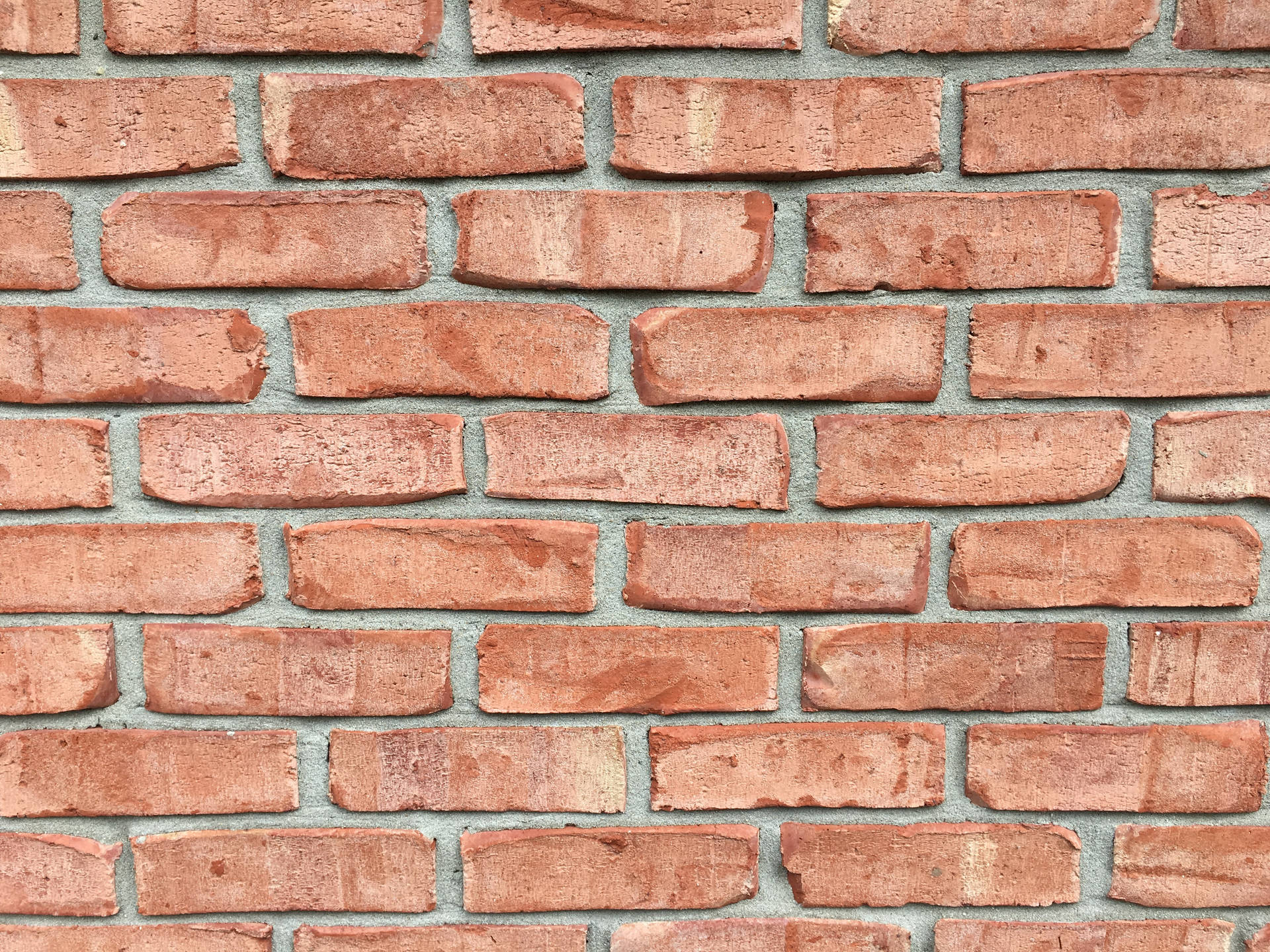 Pale Red Brick Texture With Spaces Wallpaper