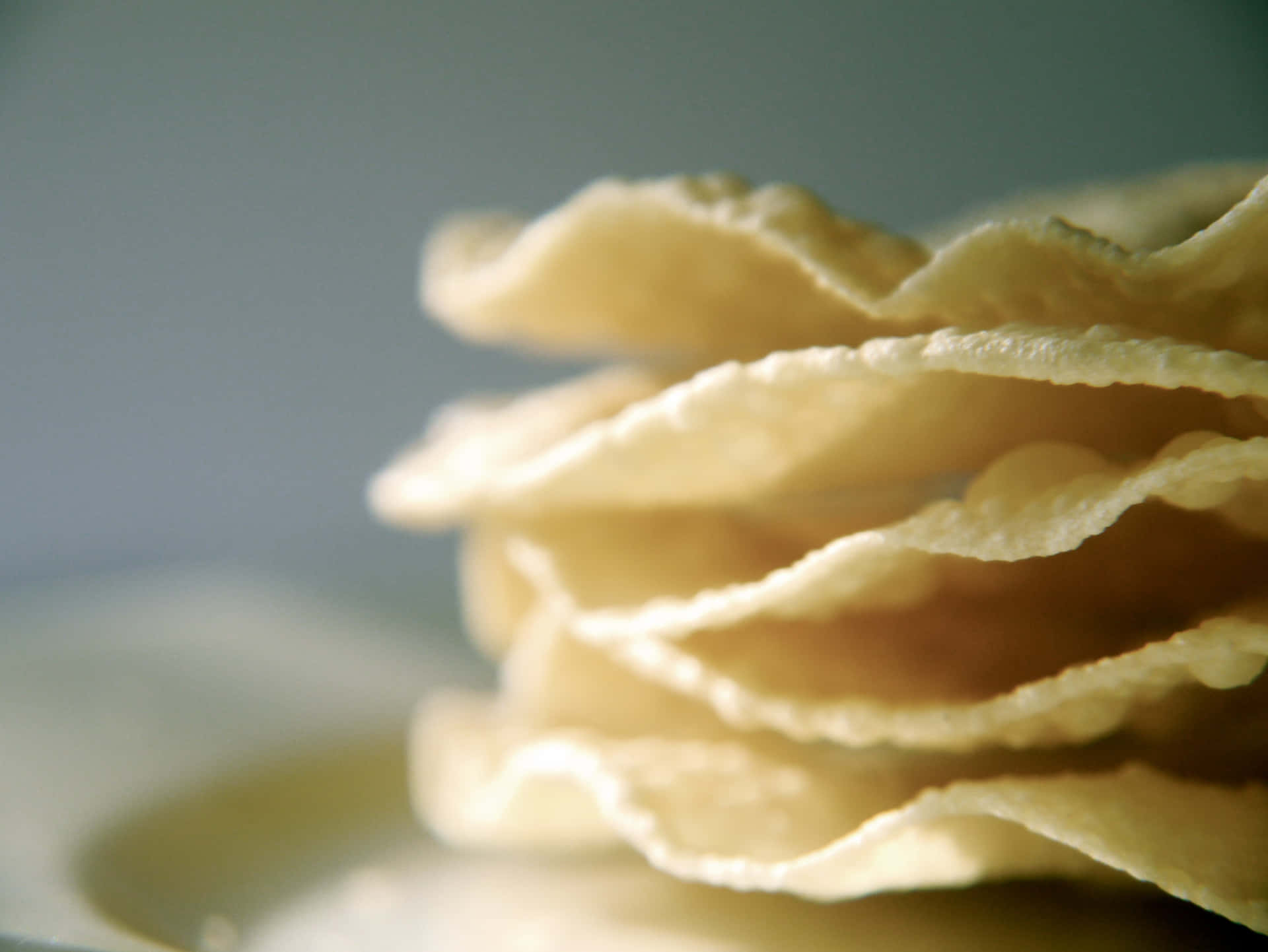 Pale-yellow Stack Of Potato Chips Wallpaper
