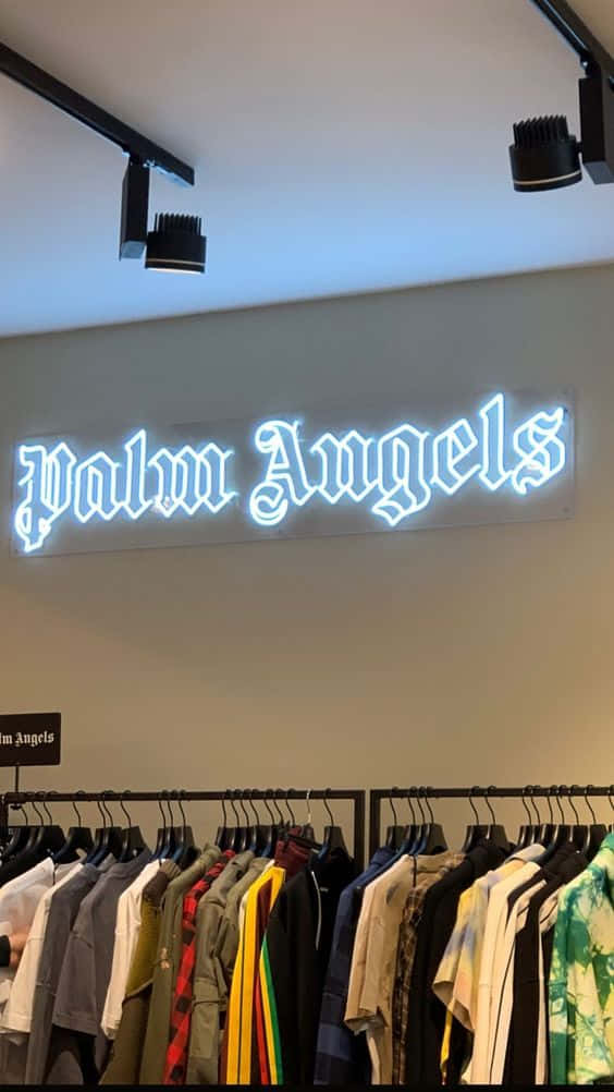 Enbutik Med En Neonskylt Som Säger Poloänglar Wallpaper
