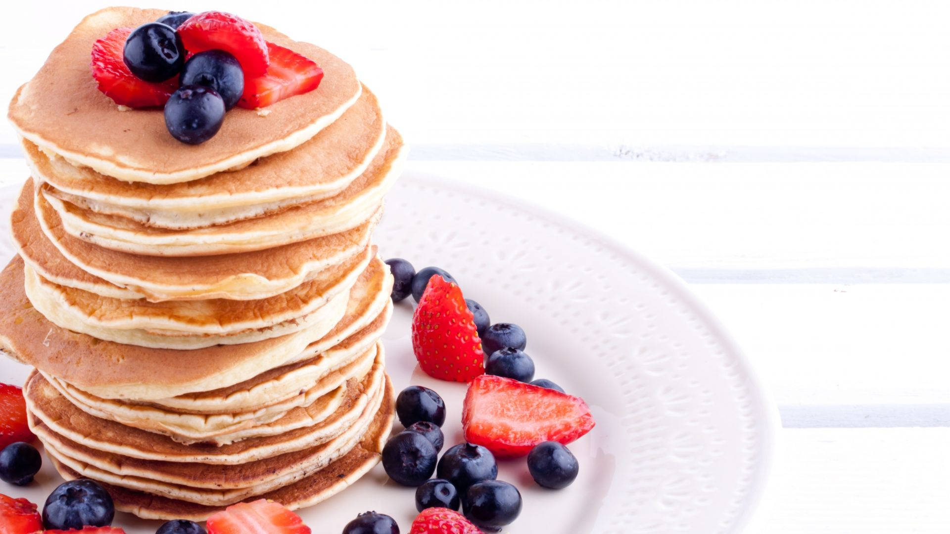 Pancakes Surrounded By Berries