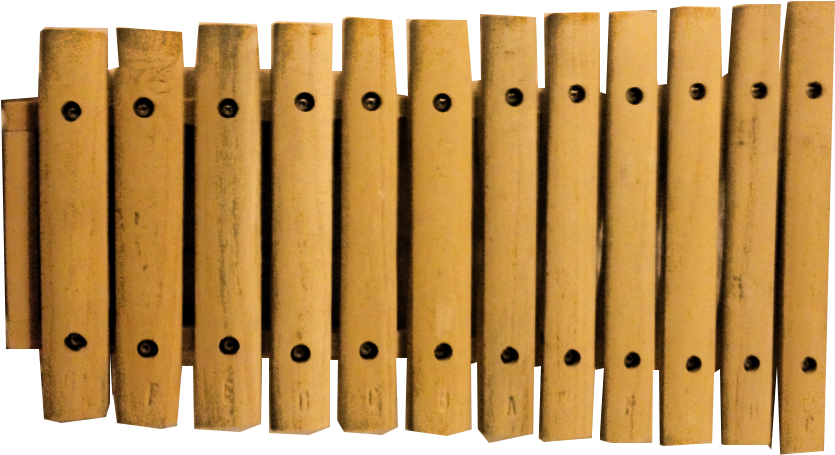 Panflute Pipes Array PNG — A close-up of a wooden xylophone with light brown bars and black screws against a black background.