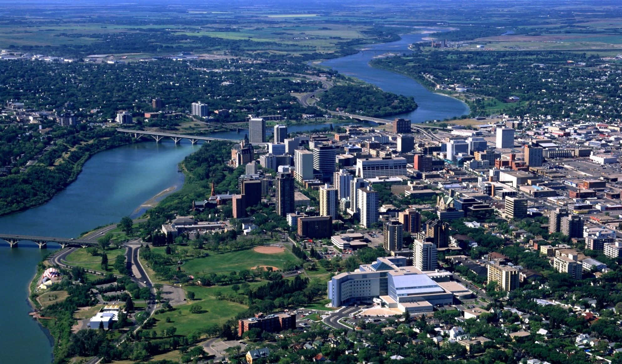 Panoramic View Of The Iconic Bessborough Hotel By South Saskatchewan River, Saskatoon Wallpaper