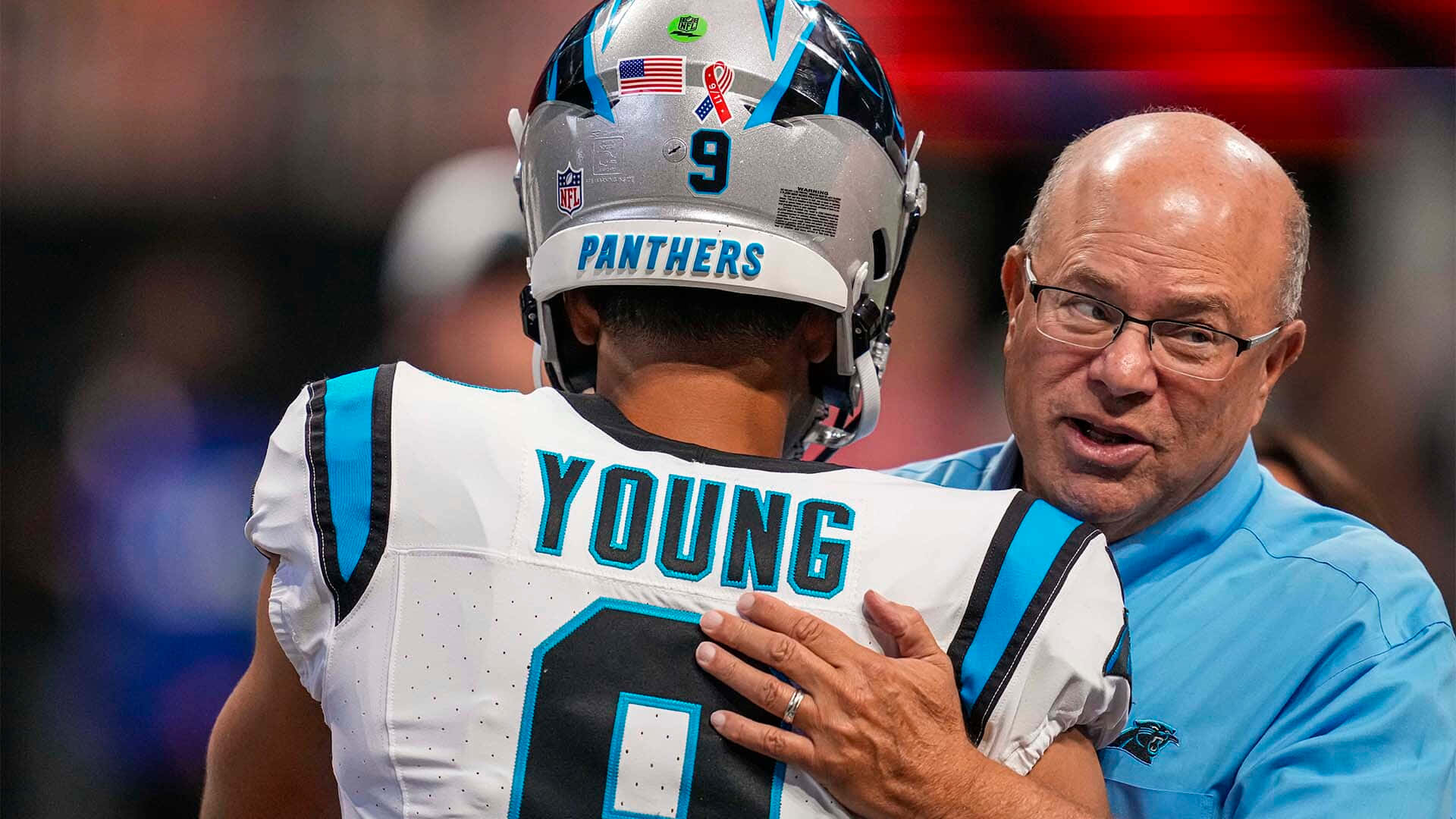 Panthers Player Youngand Coach Discussion Wallpaper