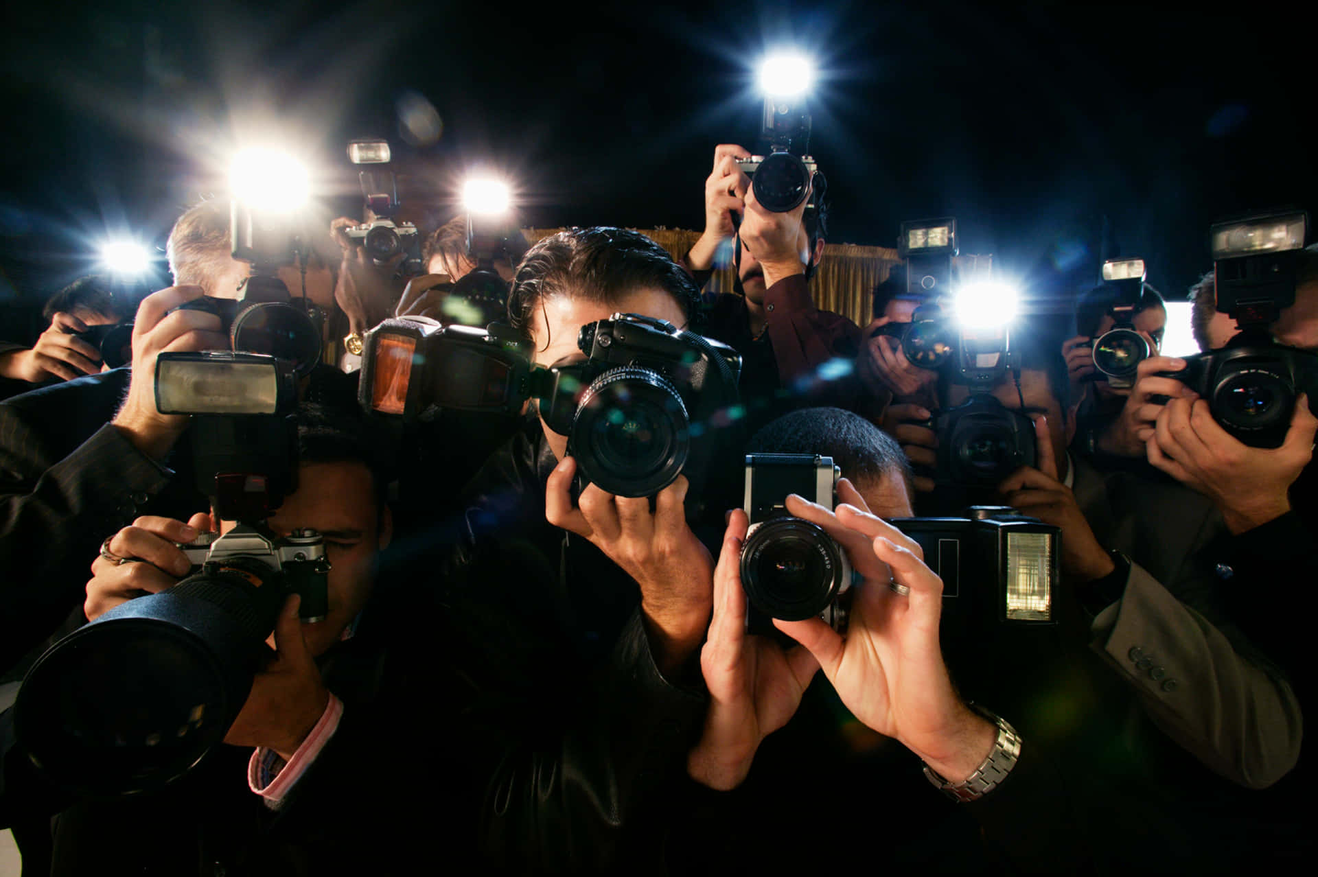 A Group Of People Holding Cameras Wallpaper