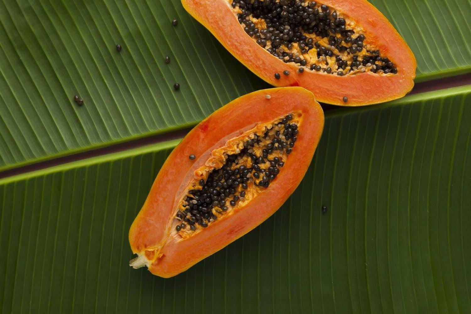 Papaya Fruits On Banana Leaf Wallpaper