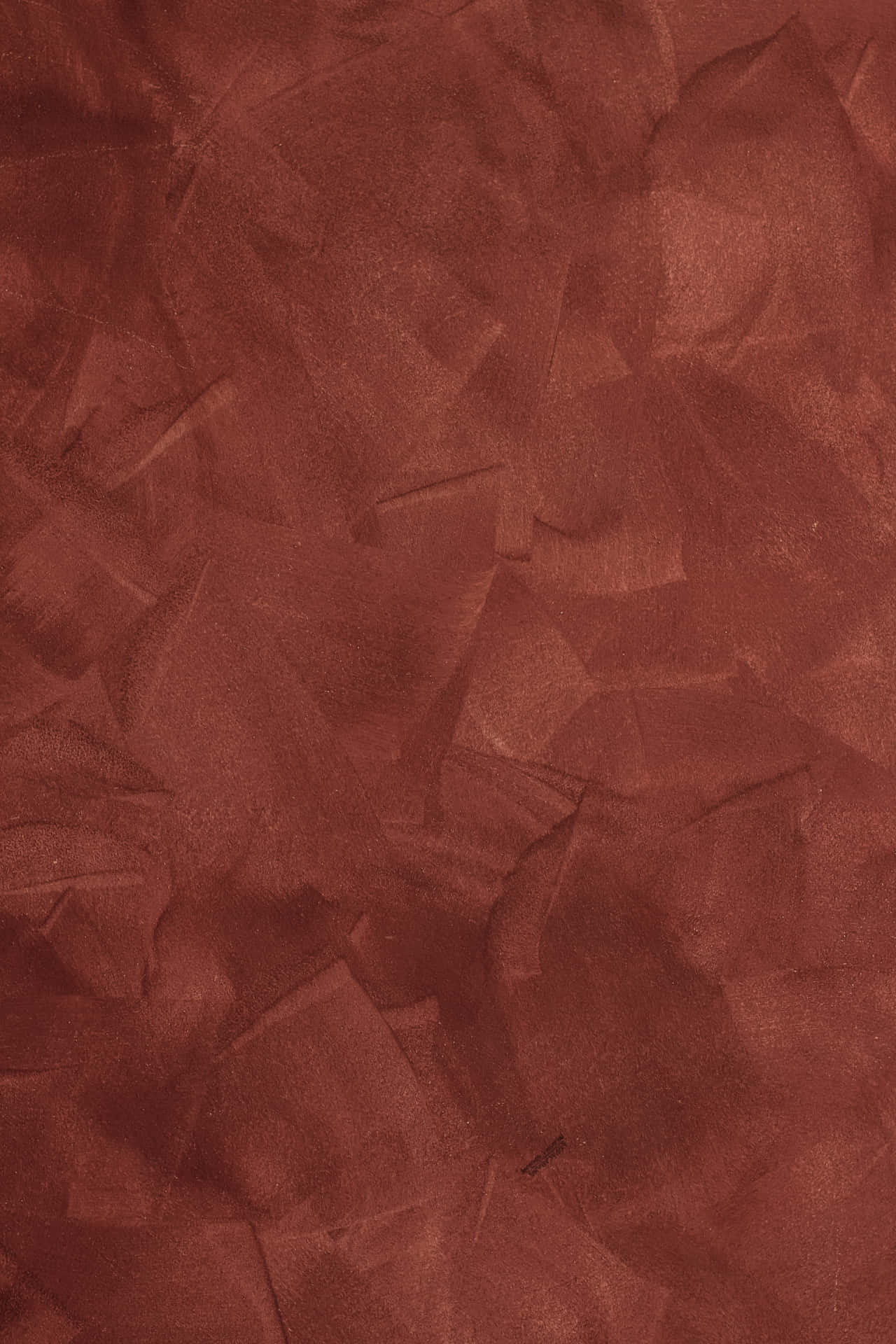Maroon Paper With Patchy Strokes Background