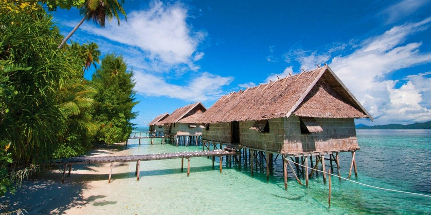 Papua New Guinea Huts By The Beach