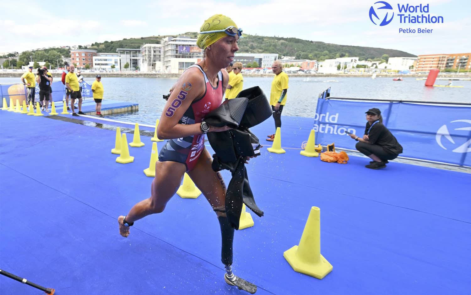 Determination Exemplified: Paralympic Triathlon Athlete in Action Wallpaper