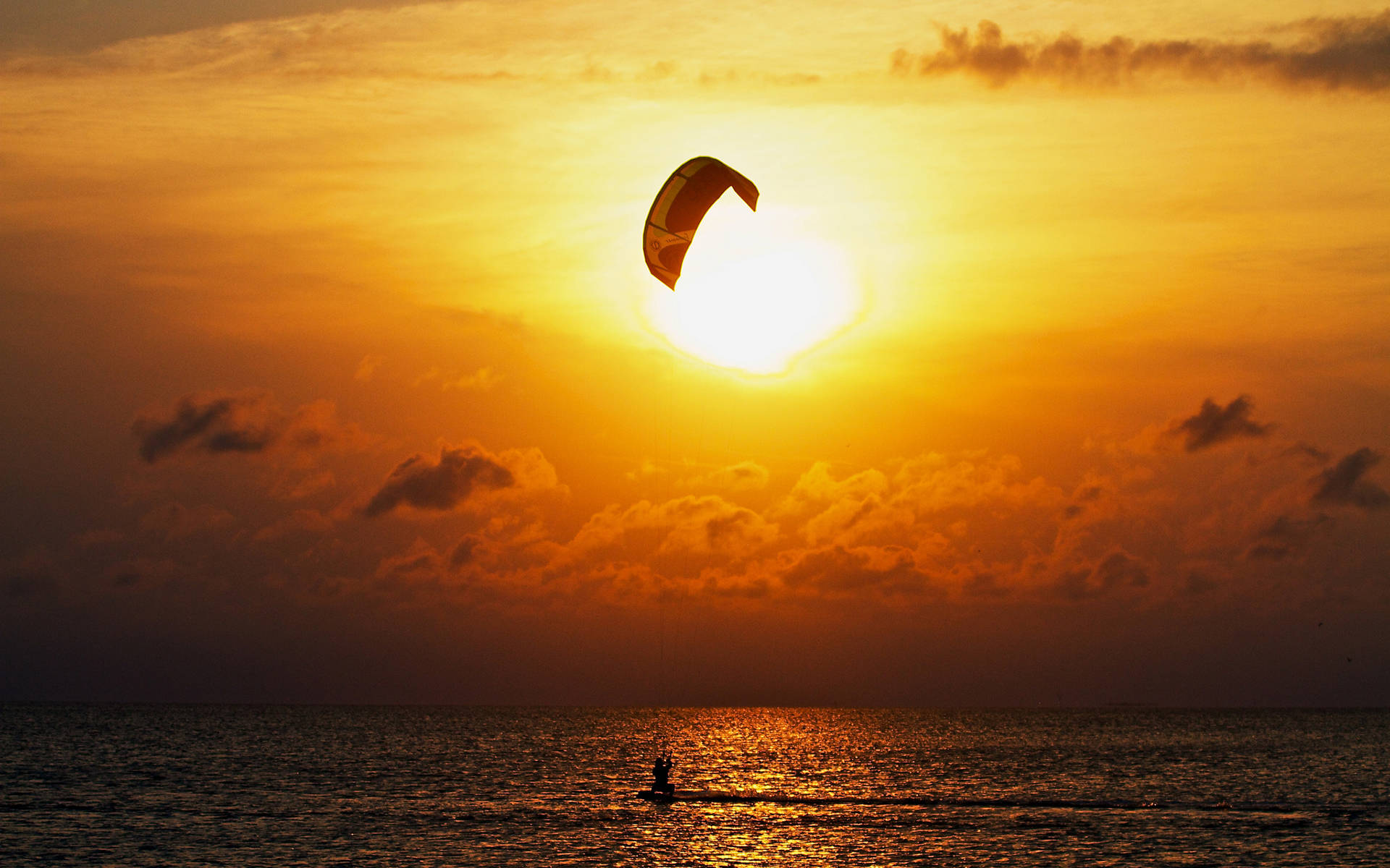 Parasailing With The View Of The Sunset Wallpaper