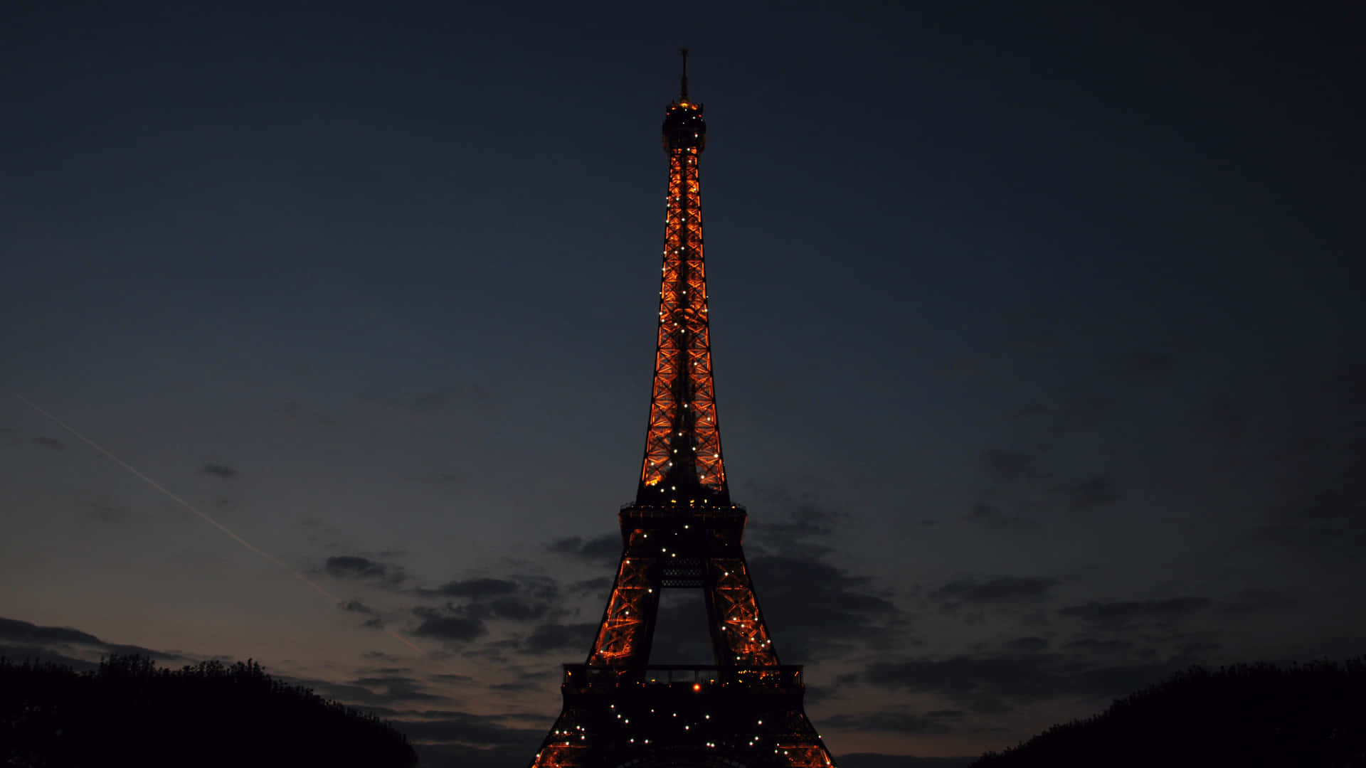 Night view of glowing Paris city Wallpaper