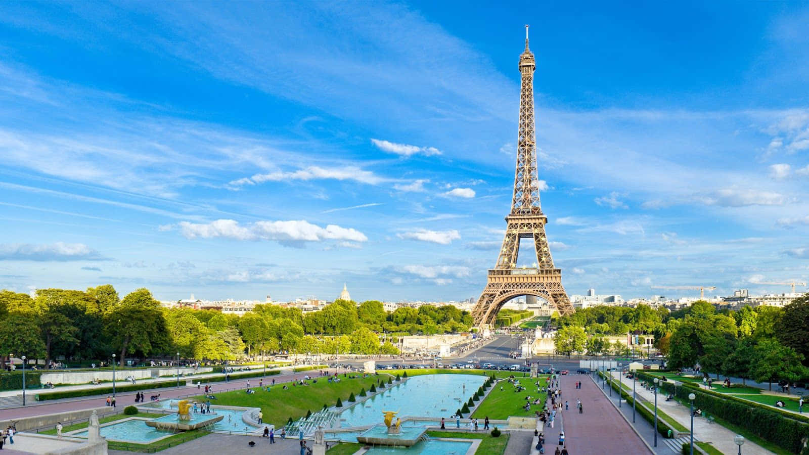 The Eiffel Tower Is Seen In The Background Wallpaper