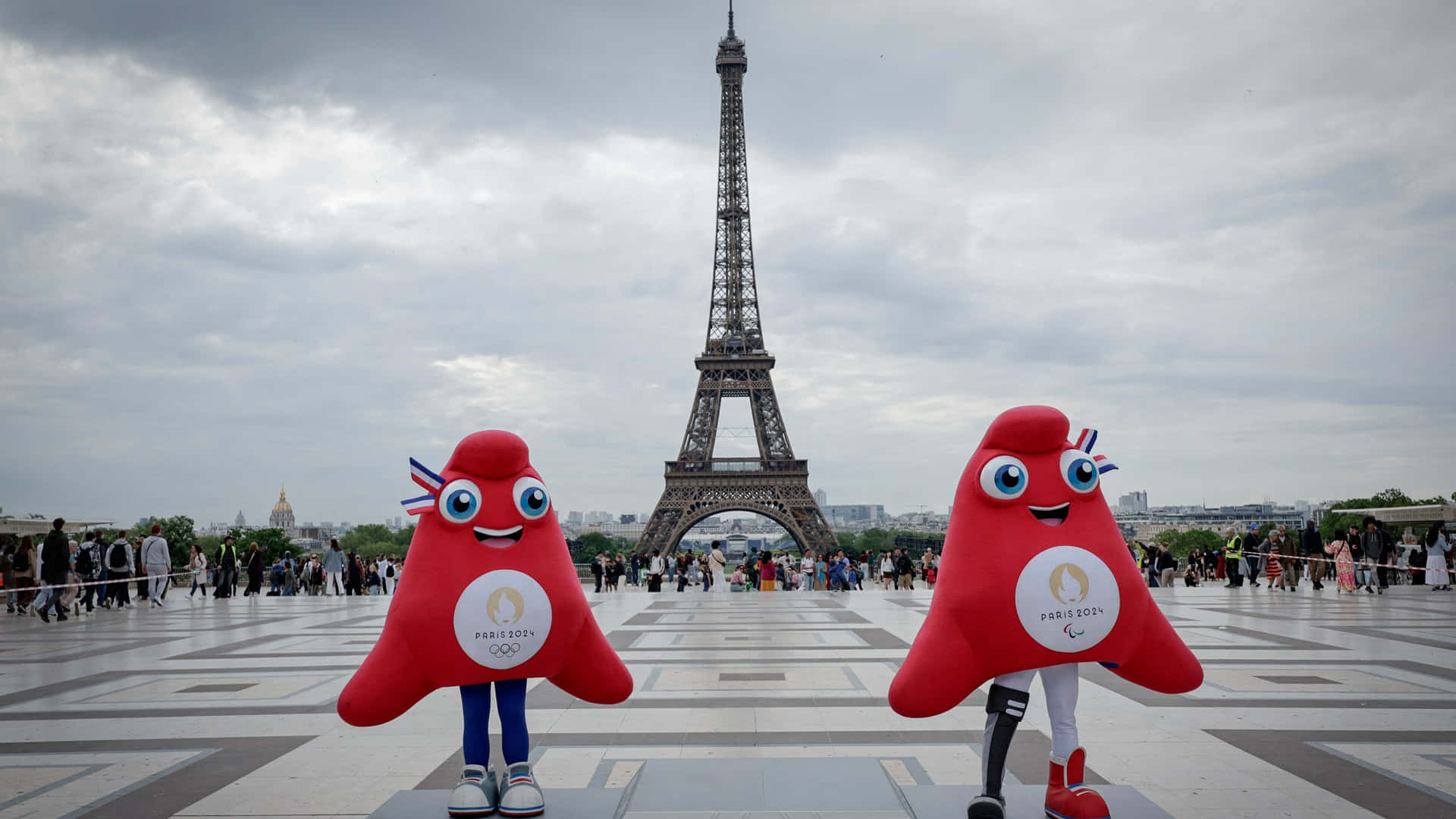 Paris2024 Olympics Mascots Eiffel Tower Wallpaper