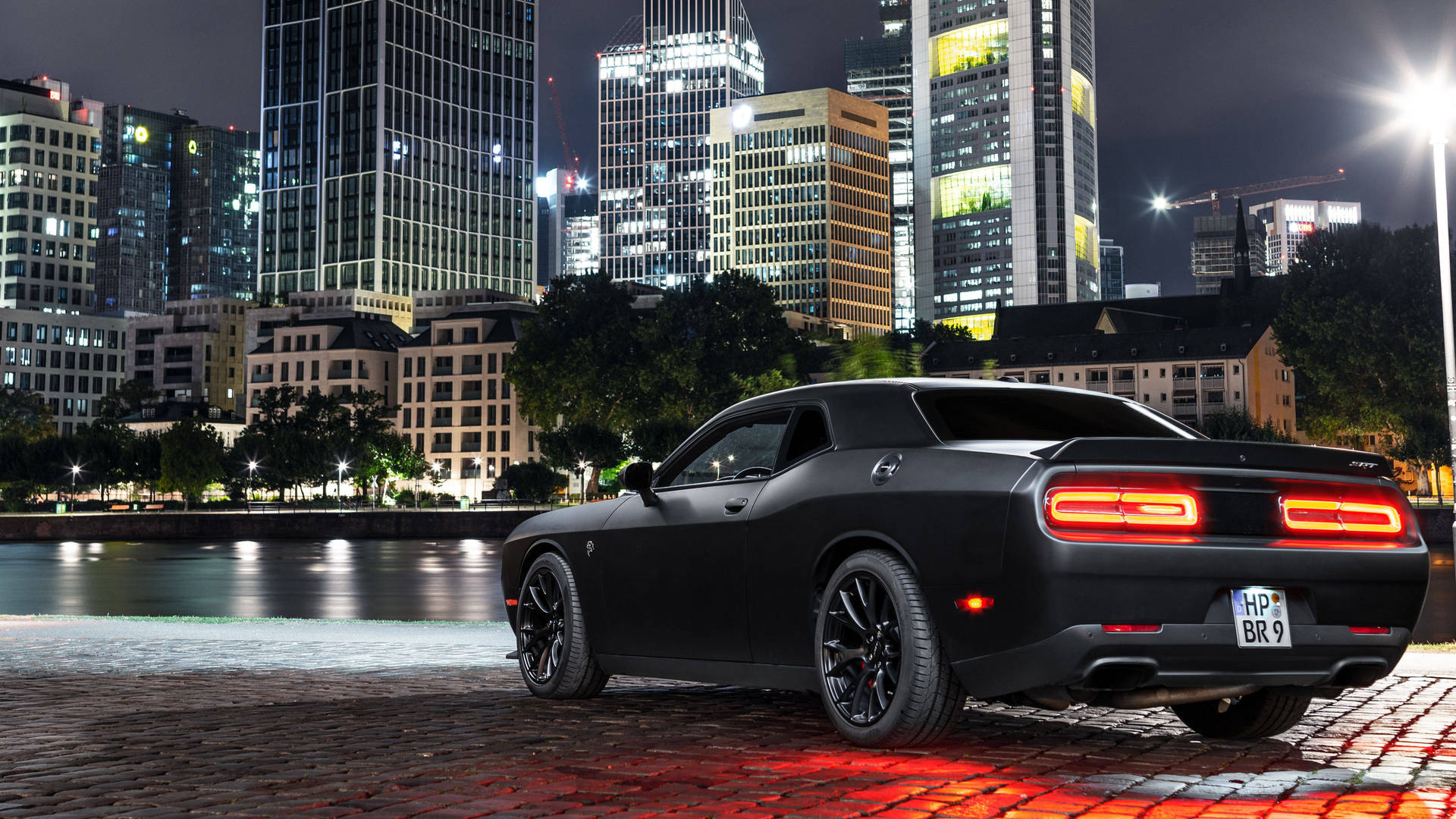 Parked Black Dodge Challenger Demon 4K Facing Buildings Wallpaper
