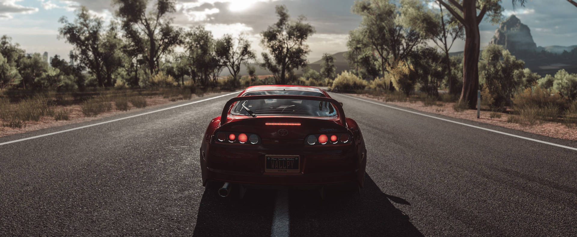 Parked Red Toyota Supra At Road Wallpaper