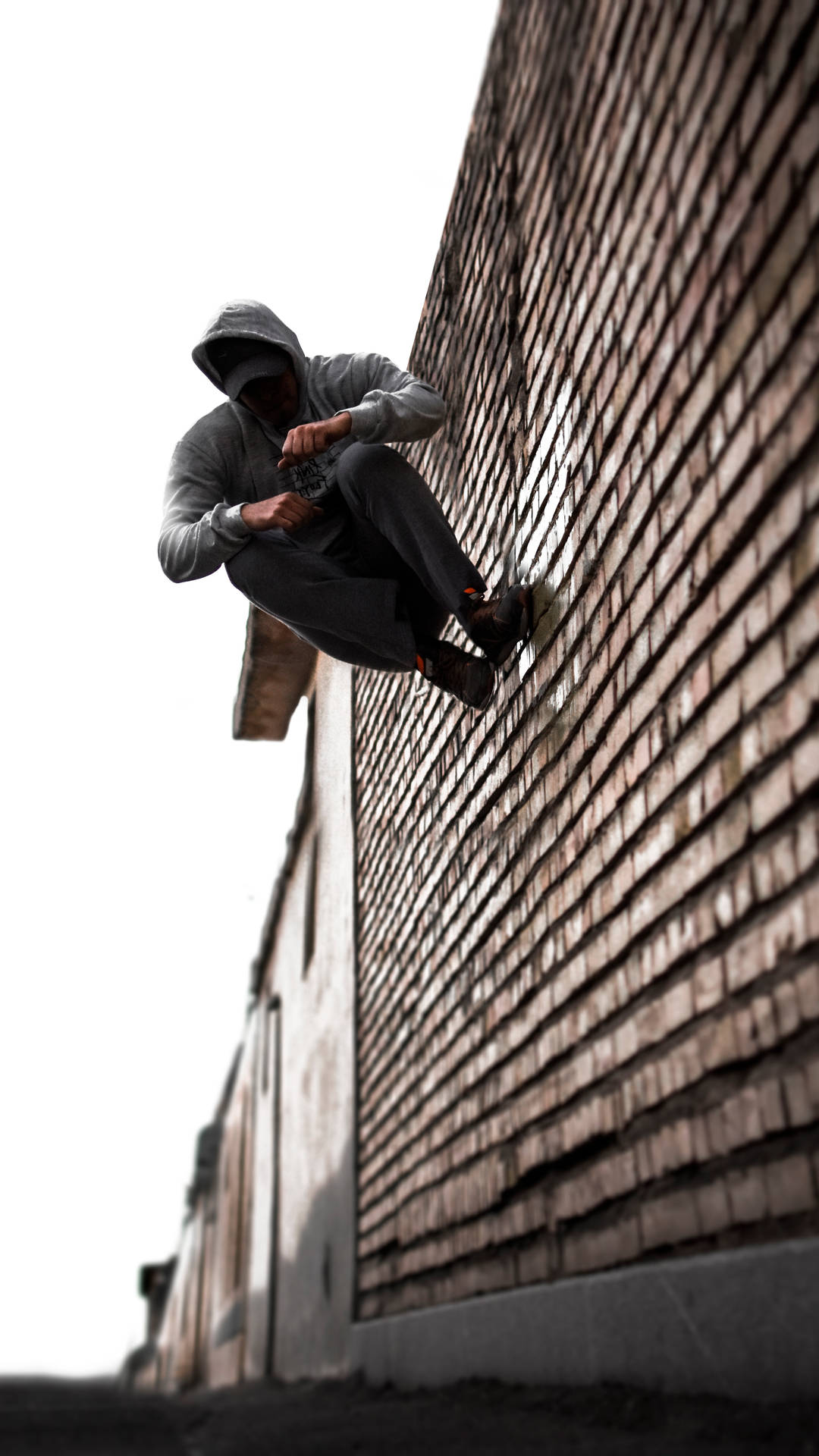 Parkour Stunt On Brick Wall Wallpaper