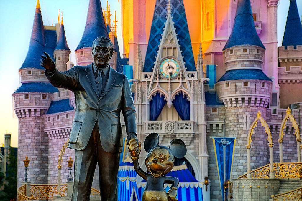 Partners Statue And Disneyworld Castle Wallpaper