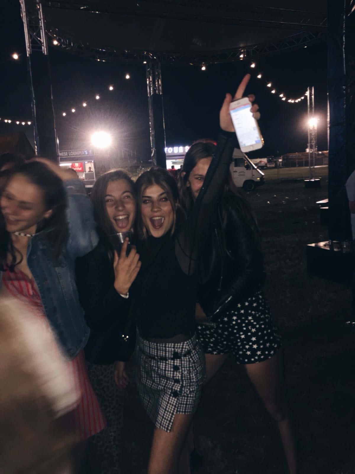 A Group Of Girls At A Festival
