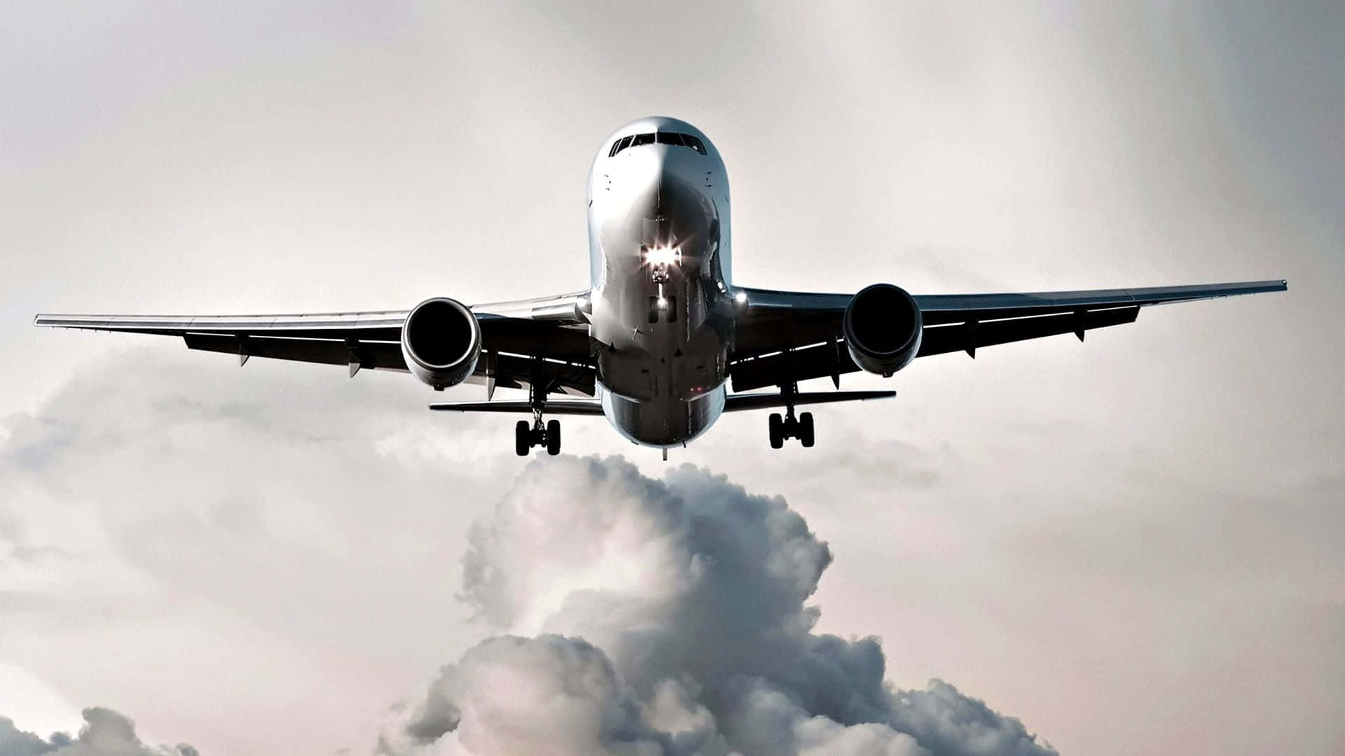 A passenger aircraft takes off into the sky. Wallpaper
