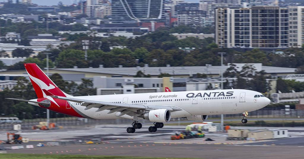 Passenger Aircraft Of Qantas On A Take Off Wallpaper