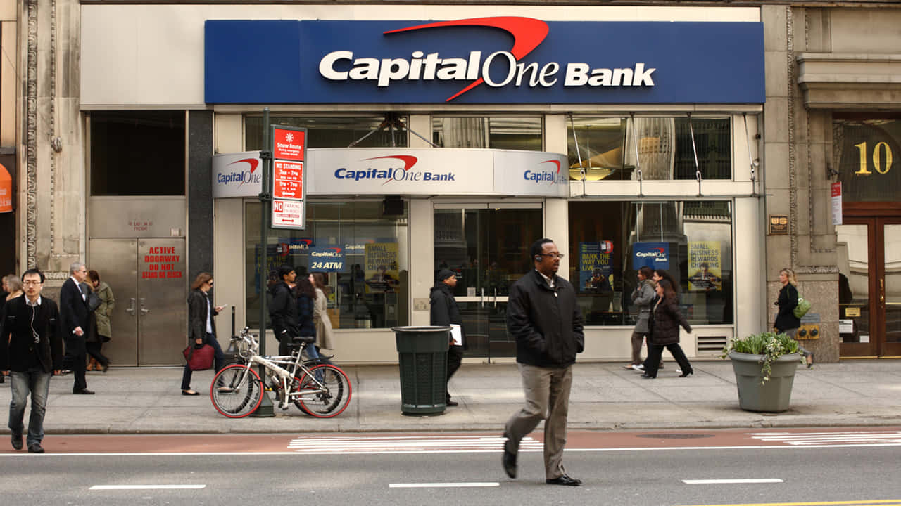 Passersby In Front Capital One Wallpaper