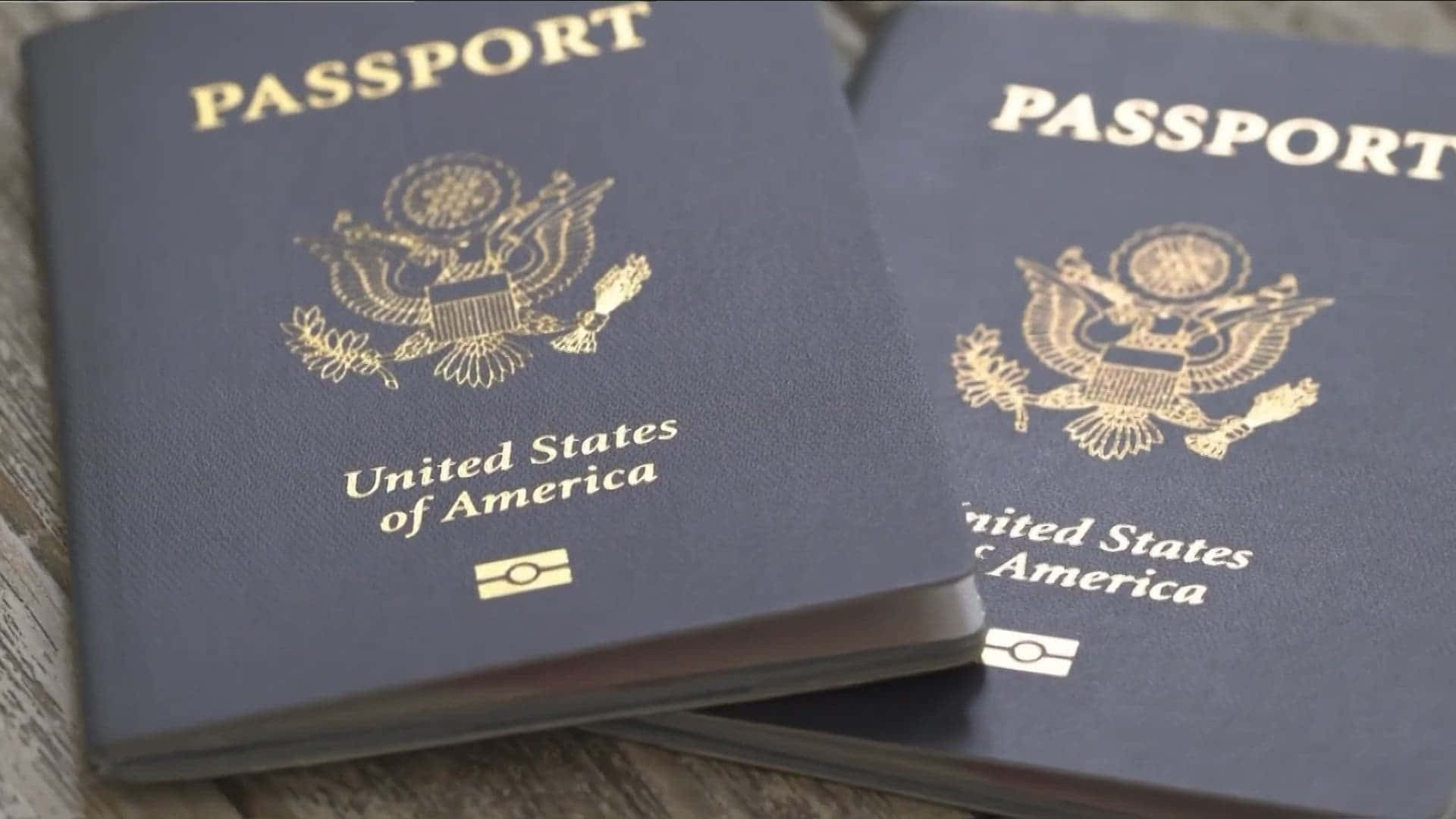 Two Passports On A Wooden Table