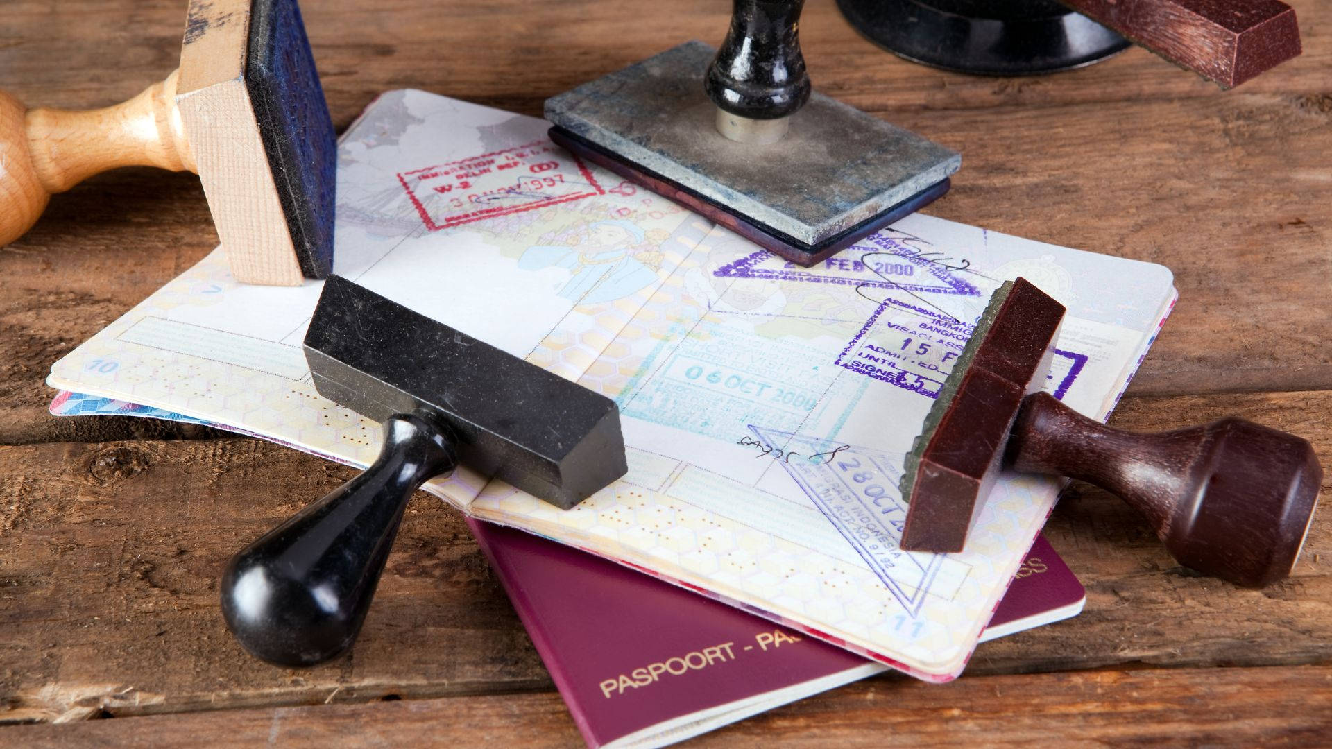 Passport Stamps On Table Wallpaper