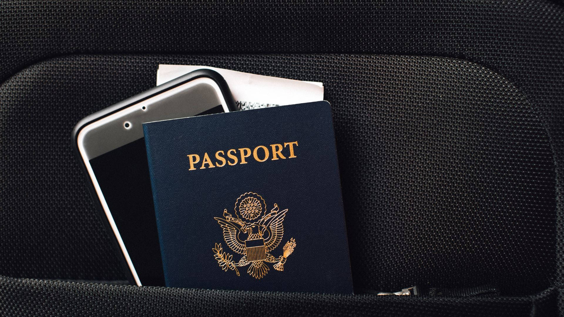 Passport With Phone Inside A Pocket Wallpaper
