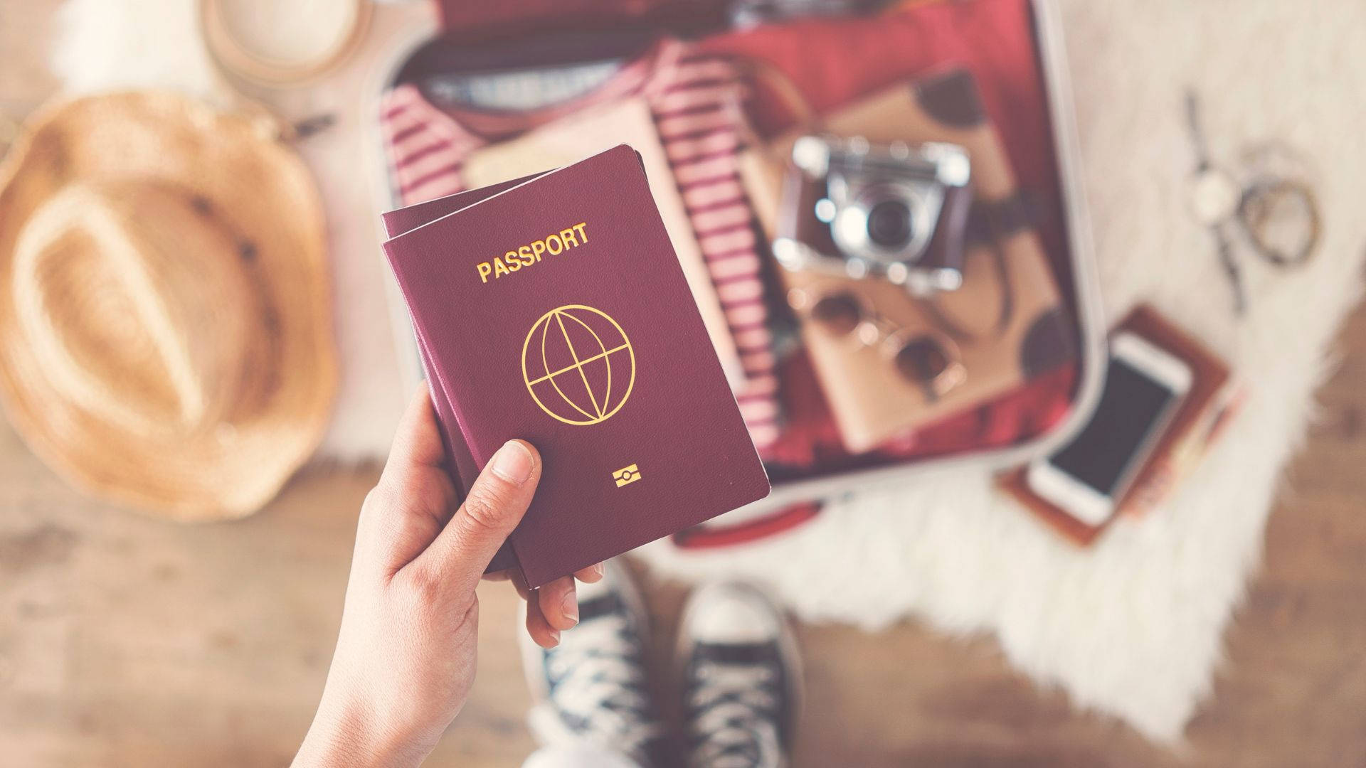 Passport With Travel Essentials Wallpaper