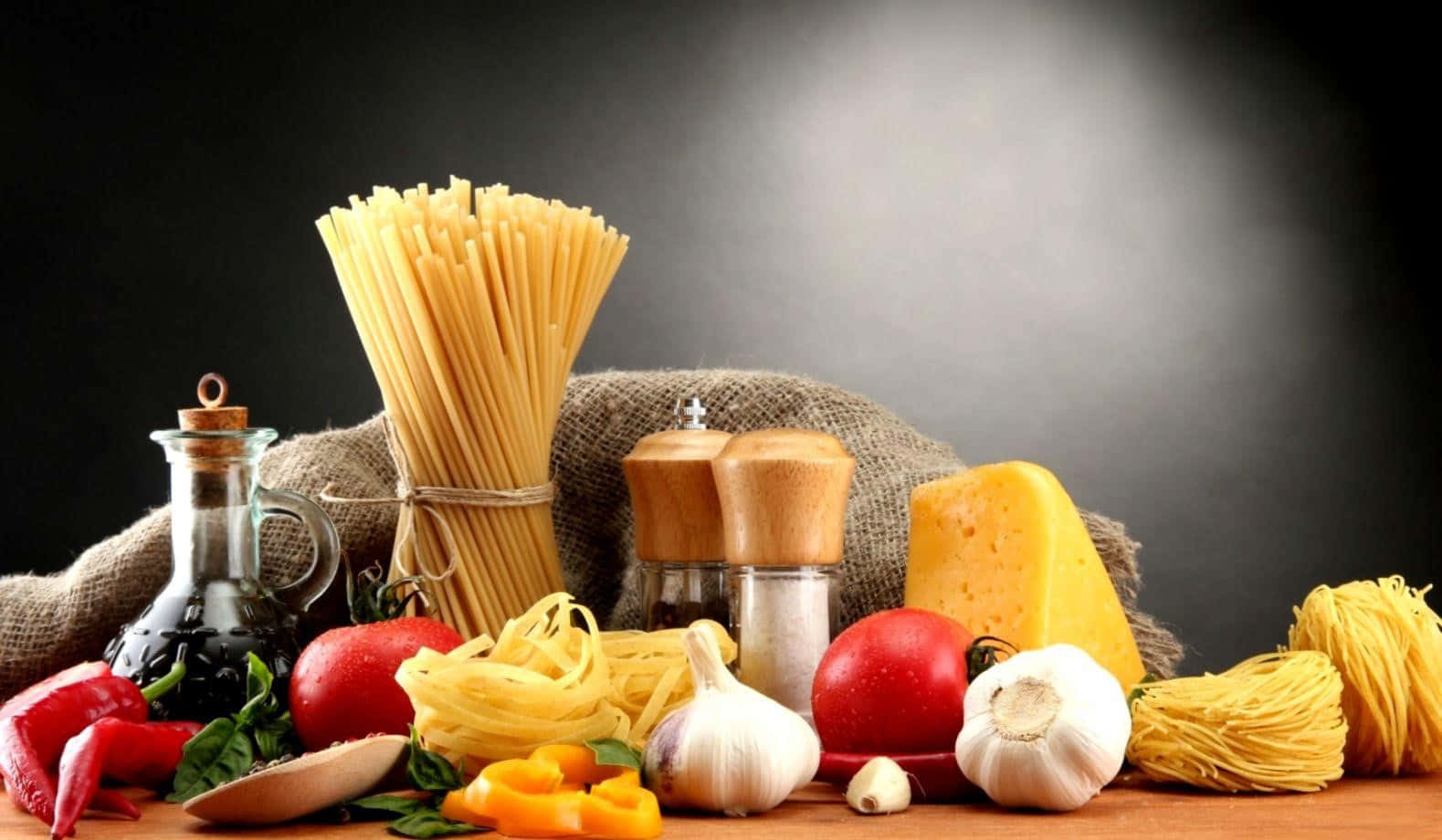 A Variety Of Pasta, Vegetables And Spices On A Table