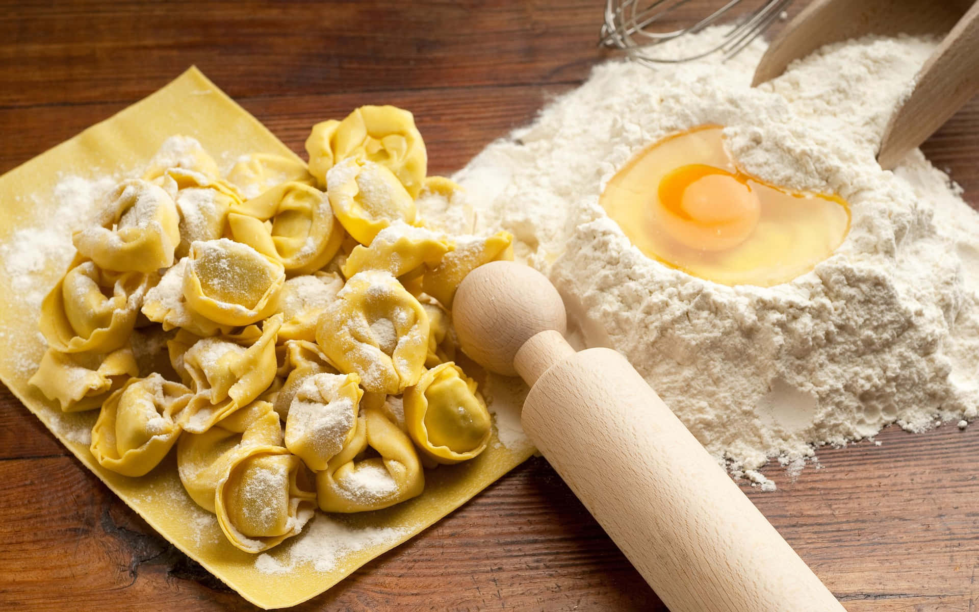 A Wooden Table With Pasta And Eggs