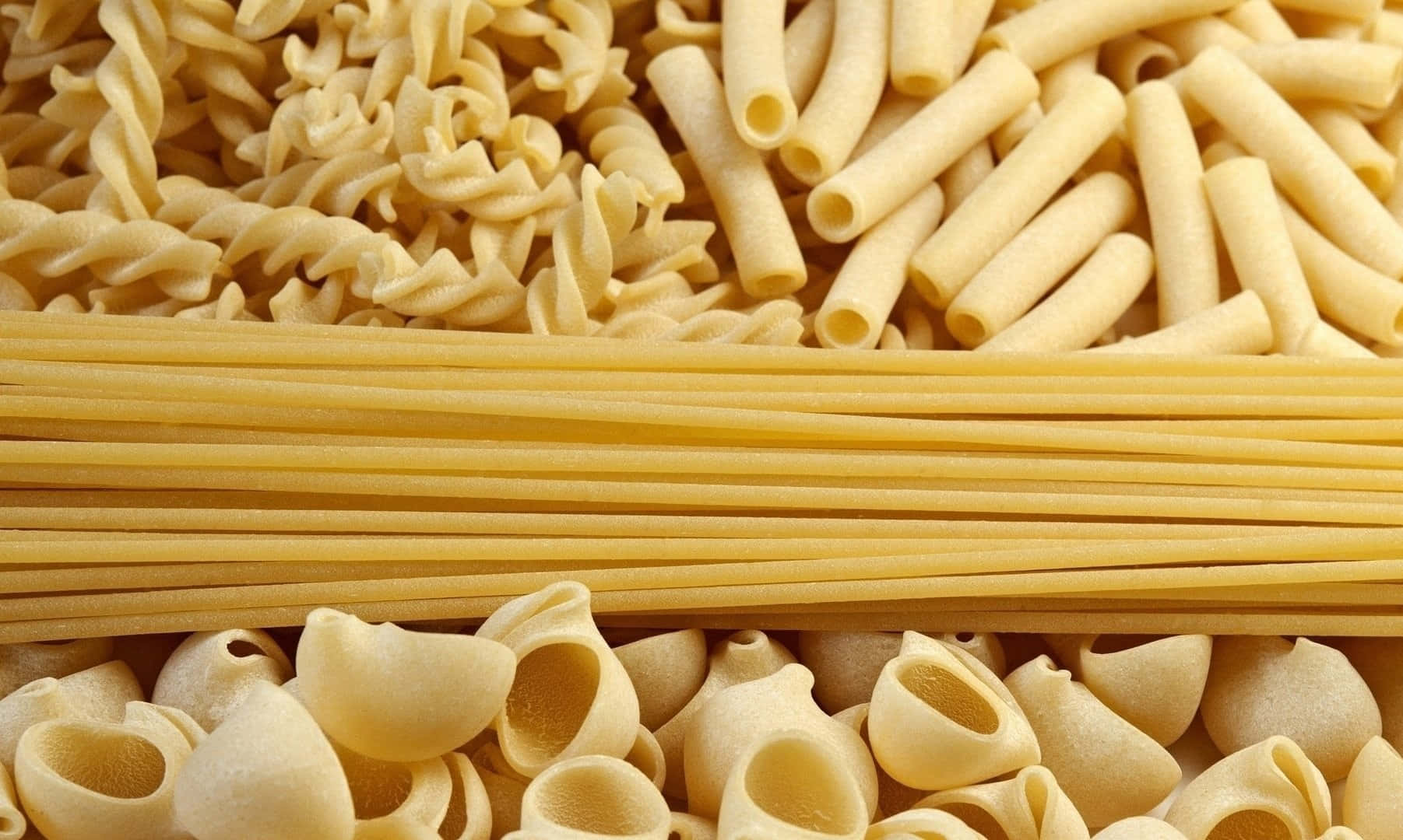 A Close Up Of Various Pastas And Noodles